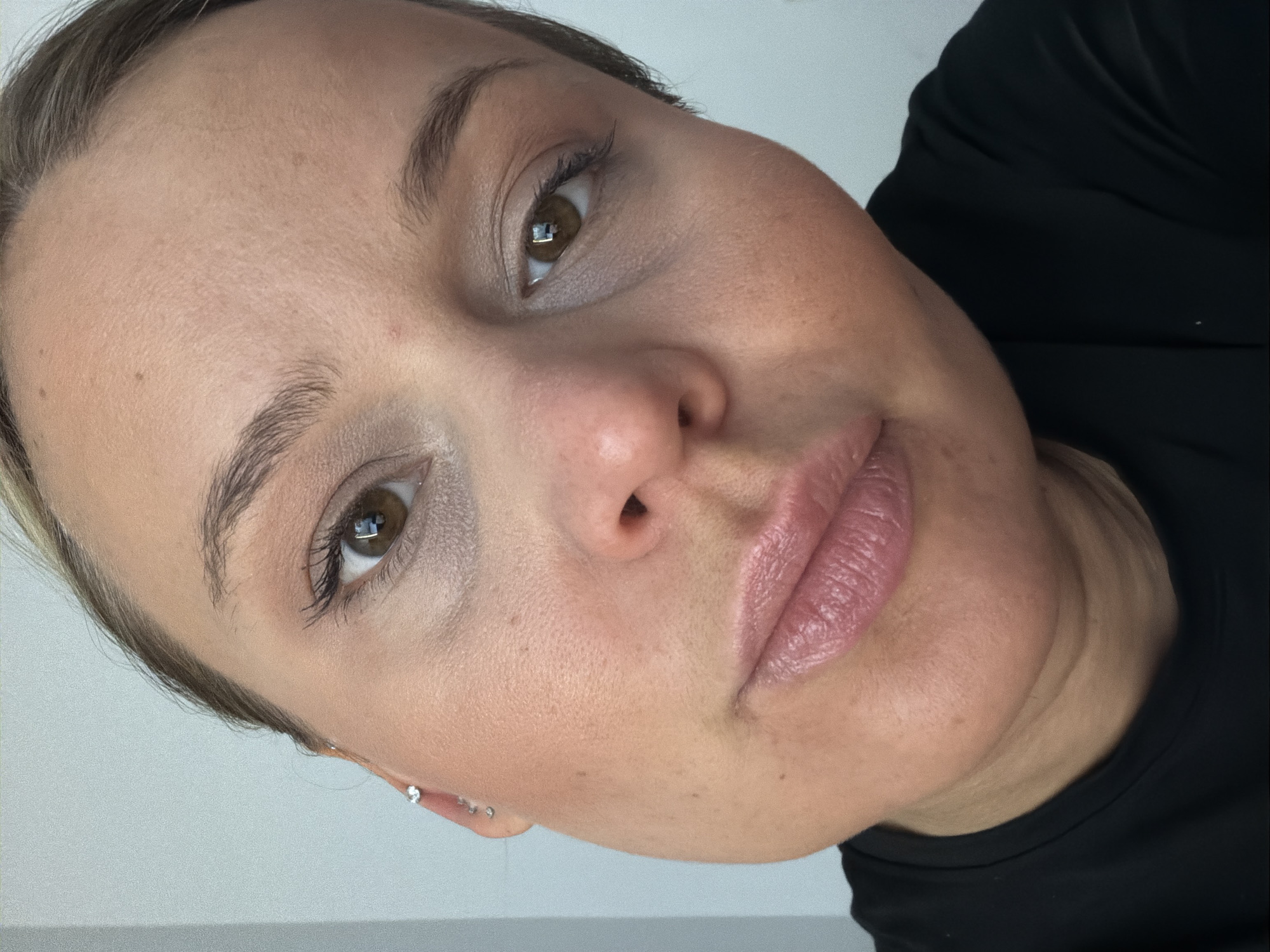 Woman takes multiple selfies at home in Sarapul, Russia