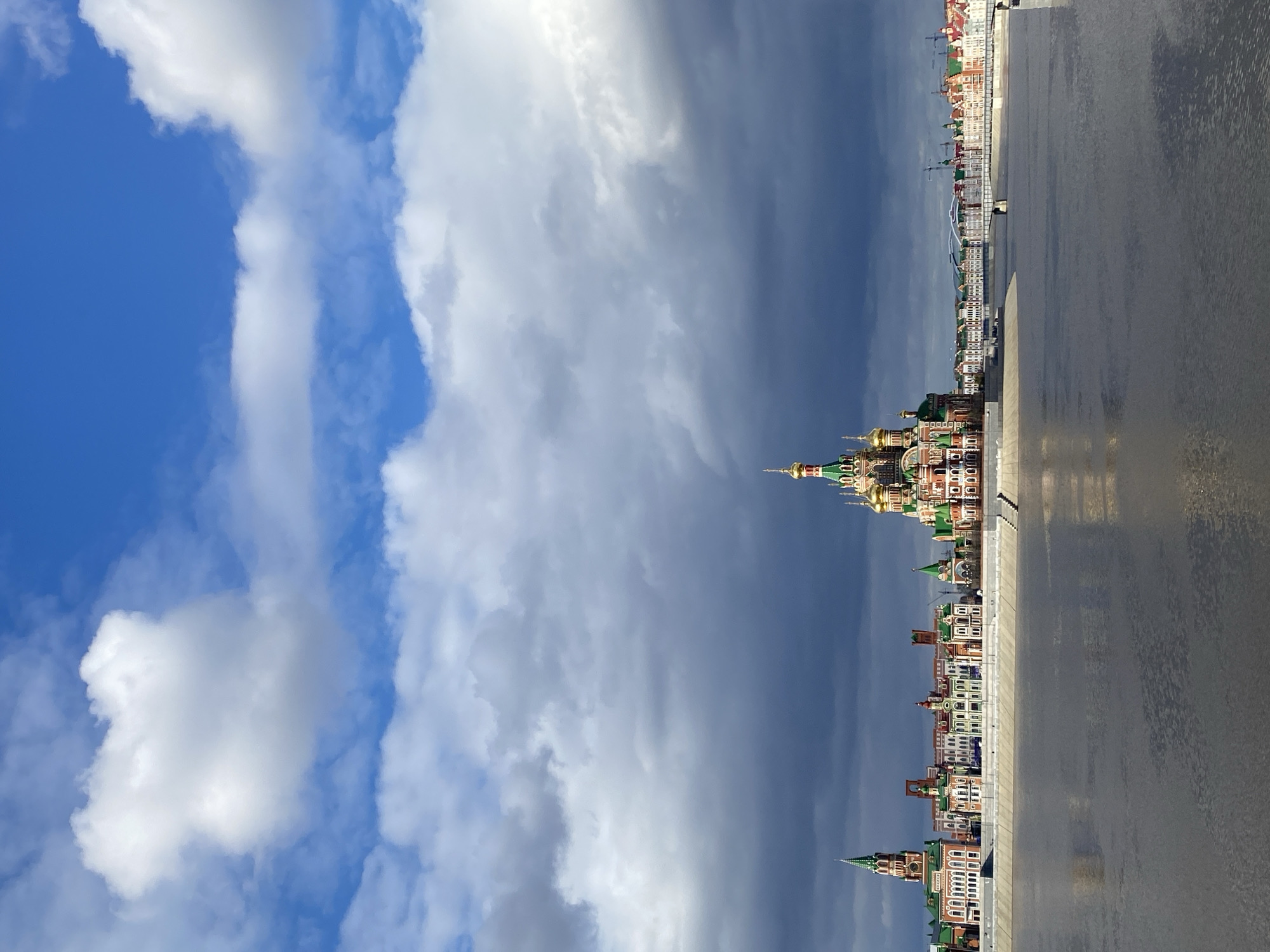 Tourist documents Yoshkar-Ola landmarks during afternoon city walk