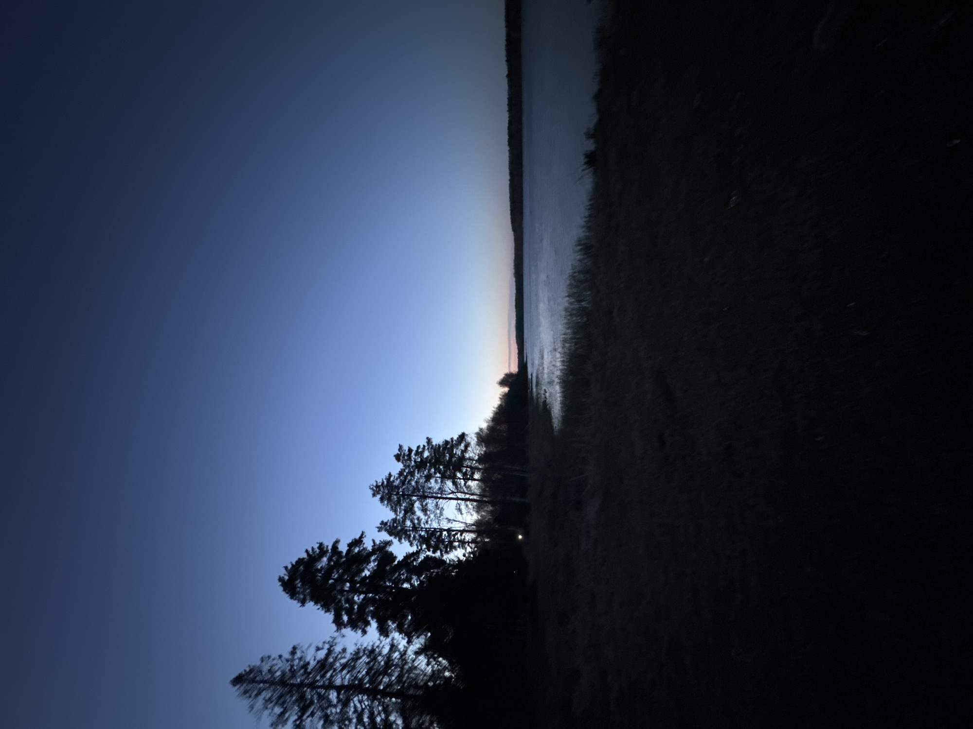 Twilight lakeside scene documented in Aleksandrovka, Russia