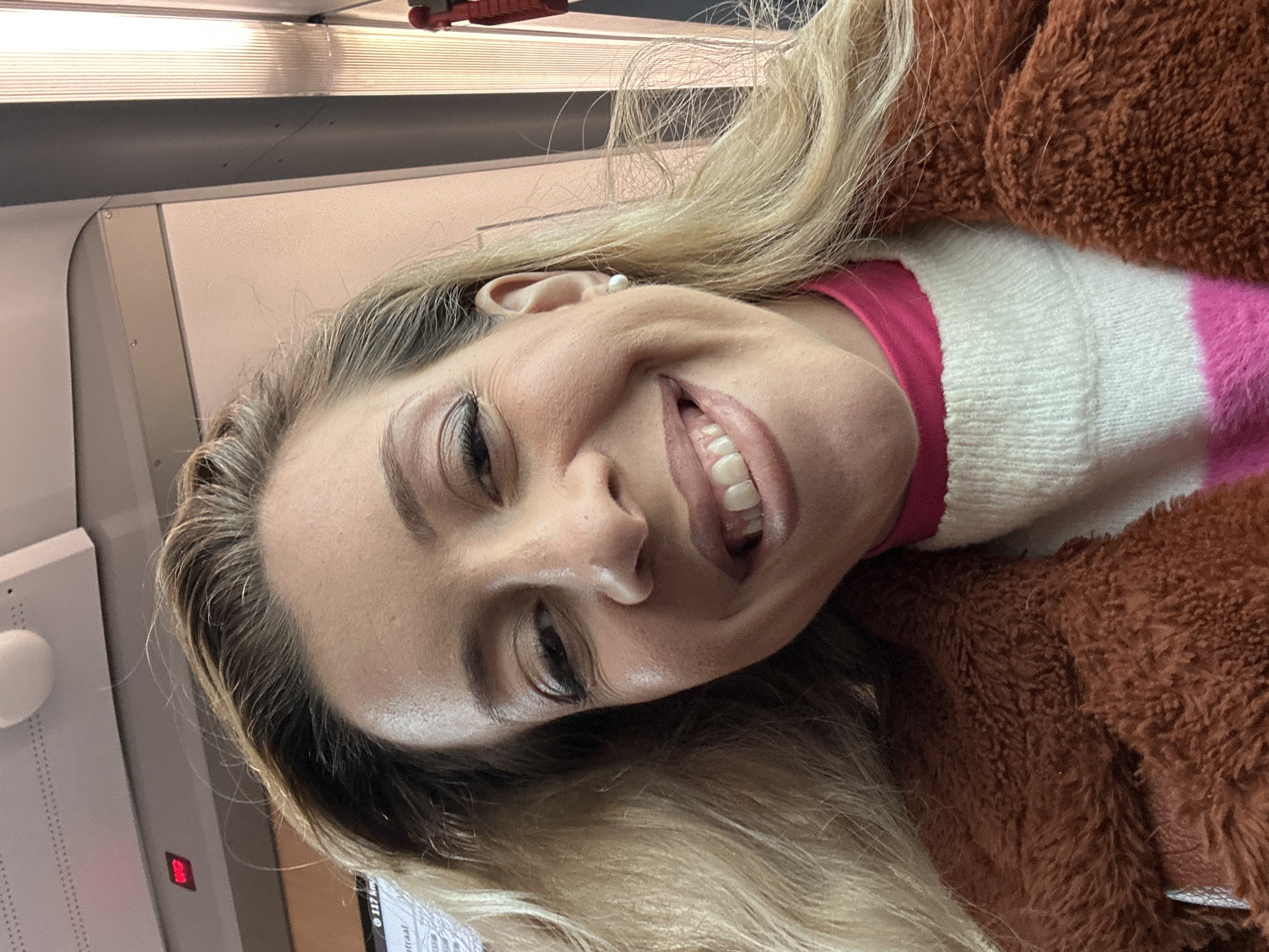 Woman photographed smiling on Amsterdam train