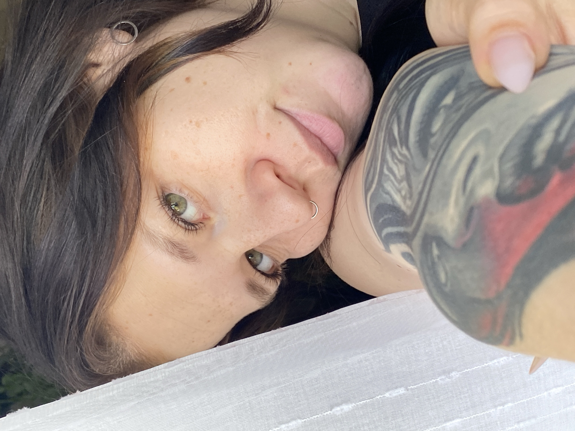 Morning photography session captures woman, plant, cat in Chaikovsky