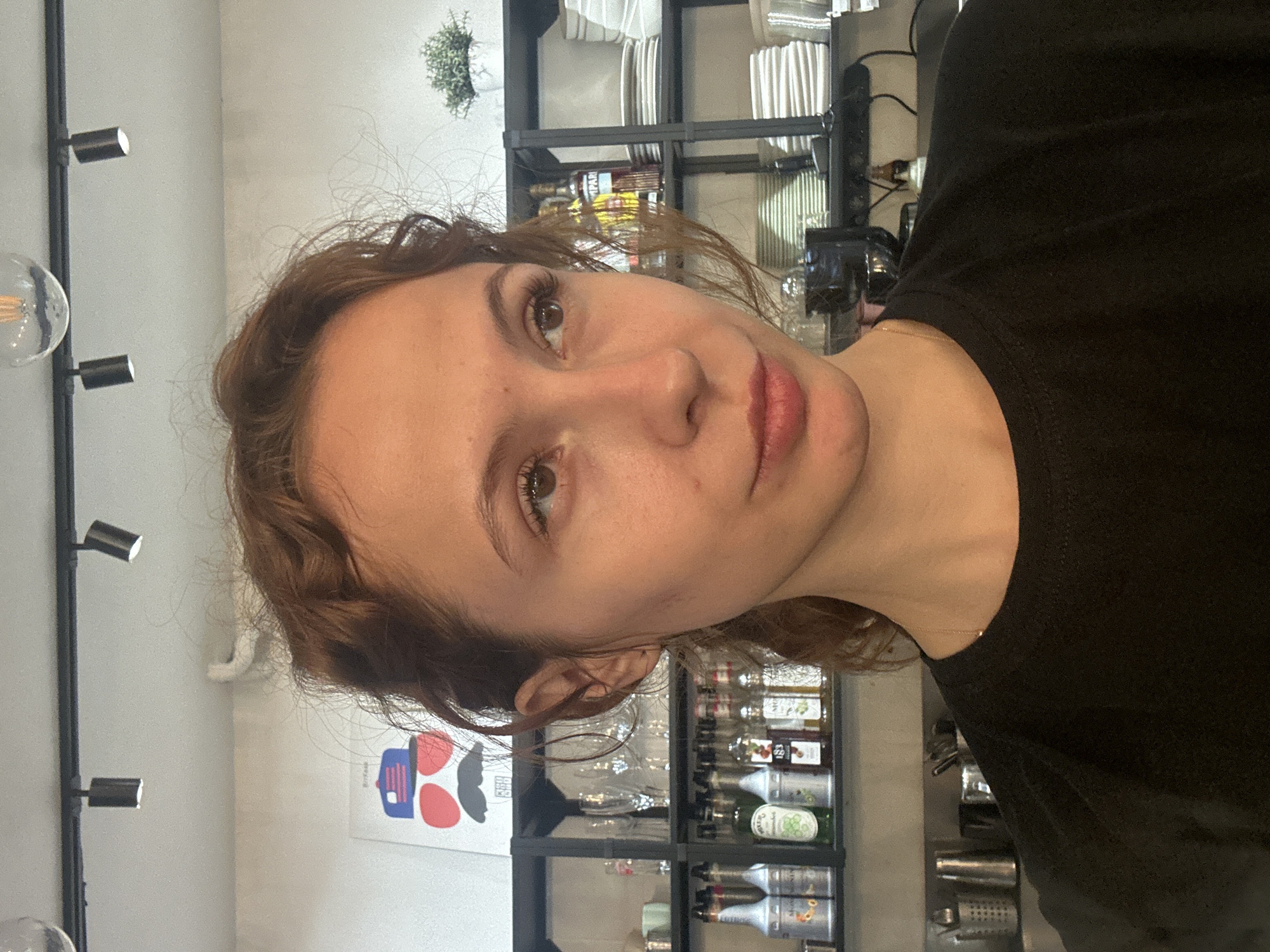 Woman documents dining experience with selfies in Novi Sad