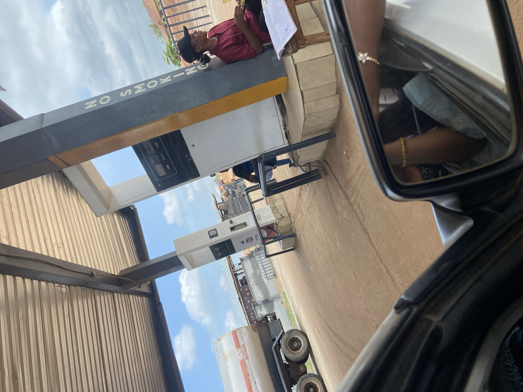 Woman seen atop gas pump in Zango-ndaji, Nigeria