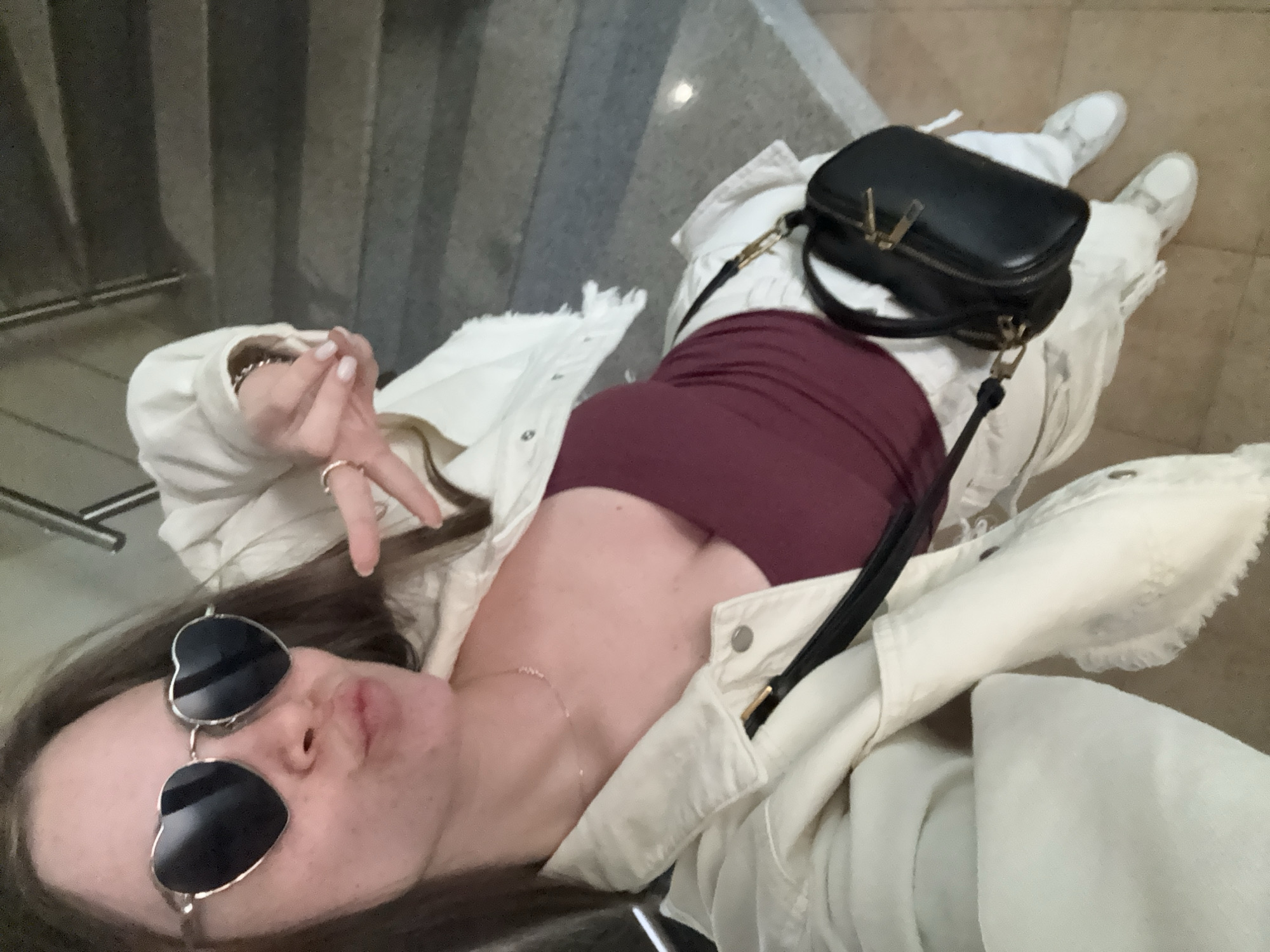 Woman takes peace sign selfie in Plovdiv, Bulgaria