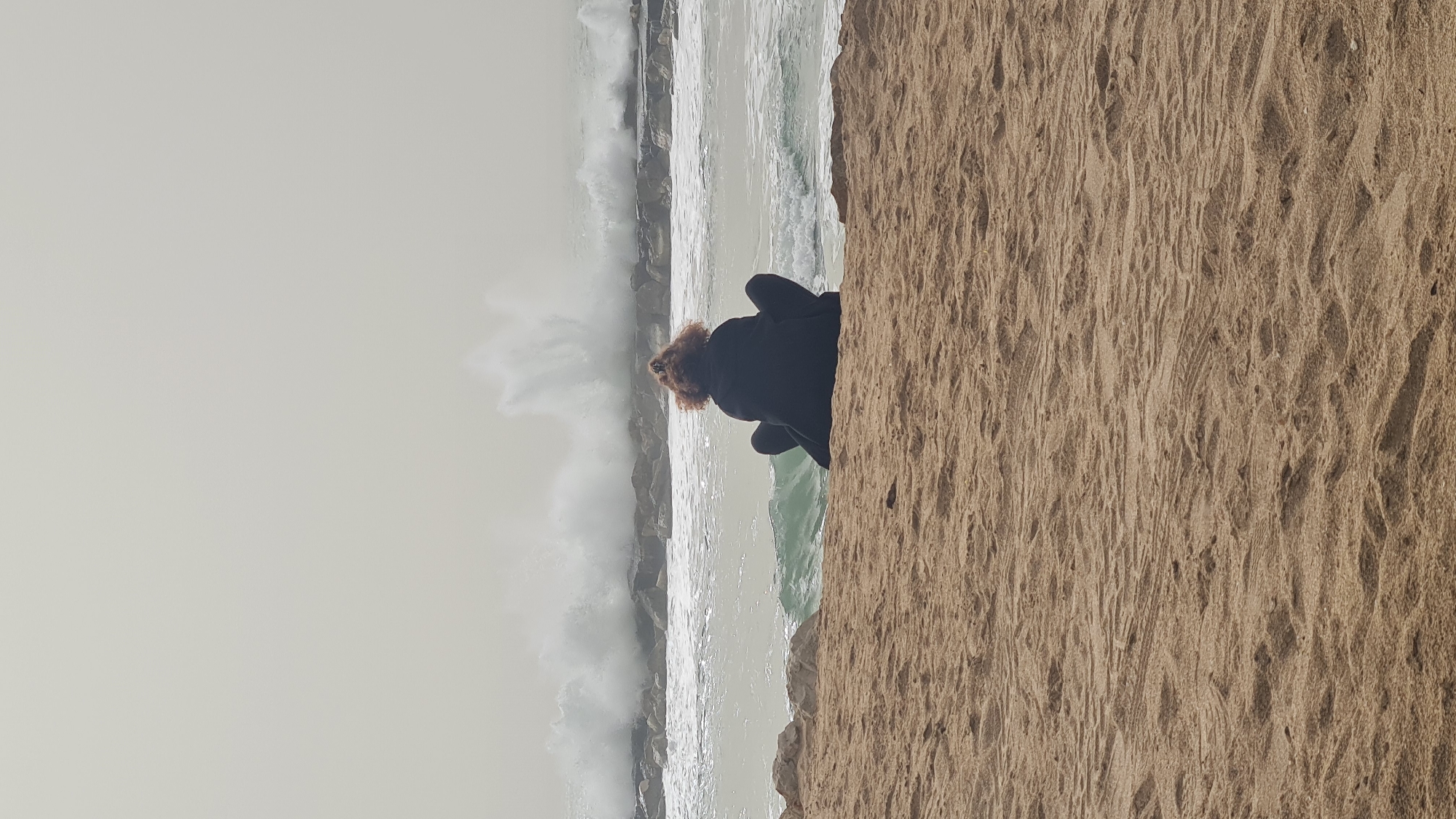 Woman photographed at Nahariyya beach in multiple casual poses