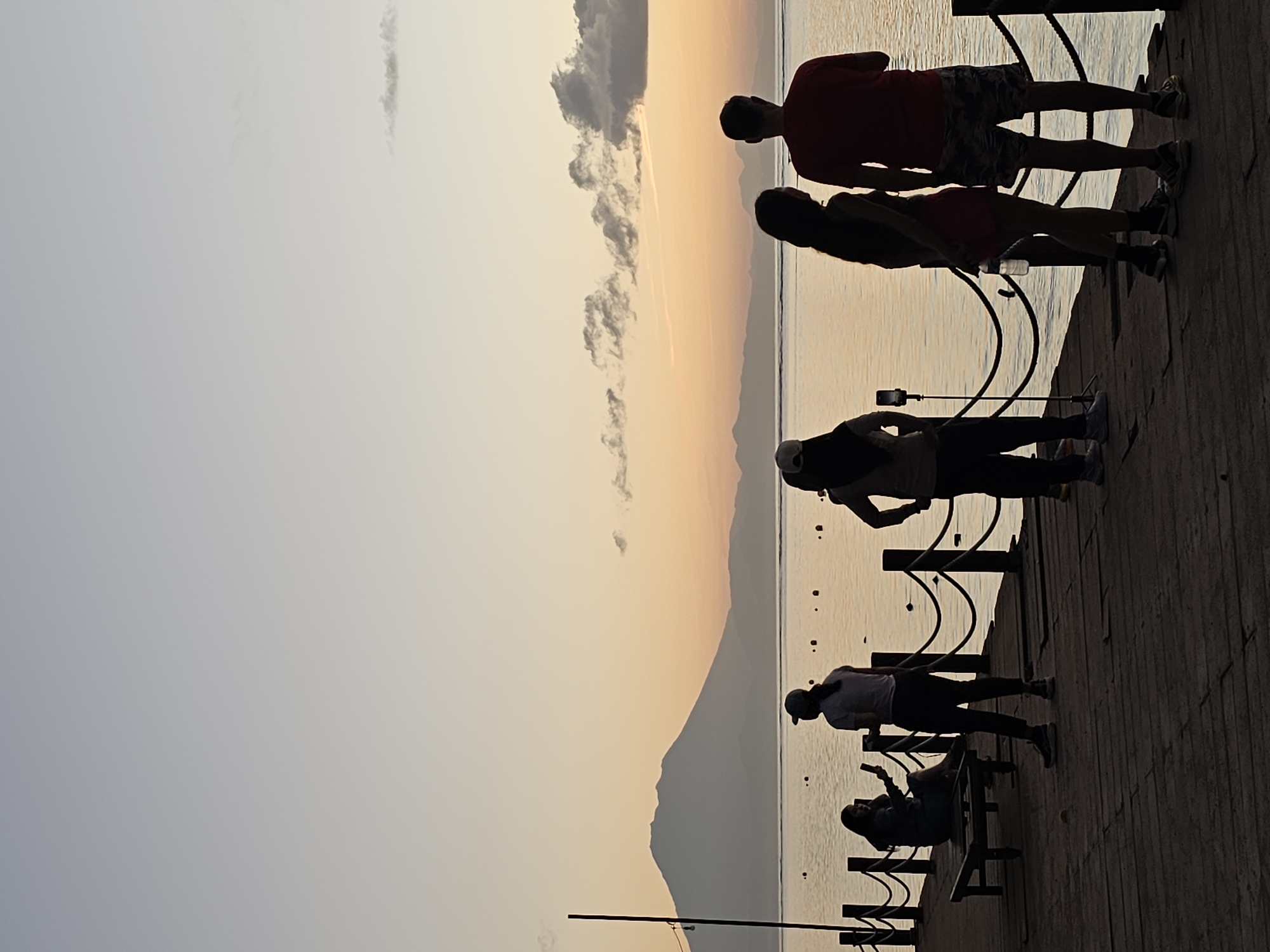 Evening crowds gather at Denpasar waterfront for sunset viewing