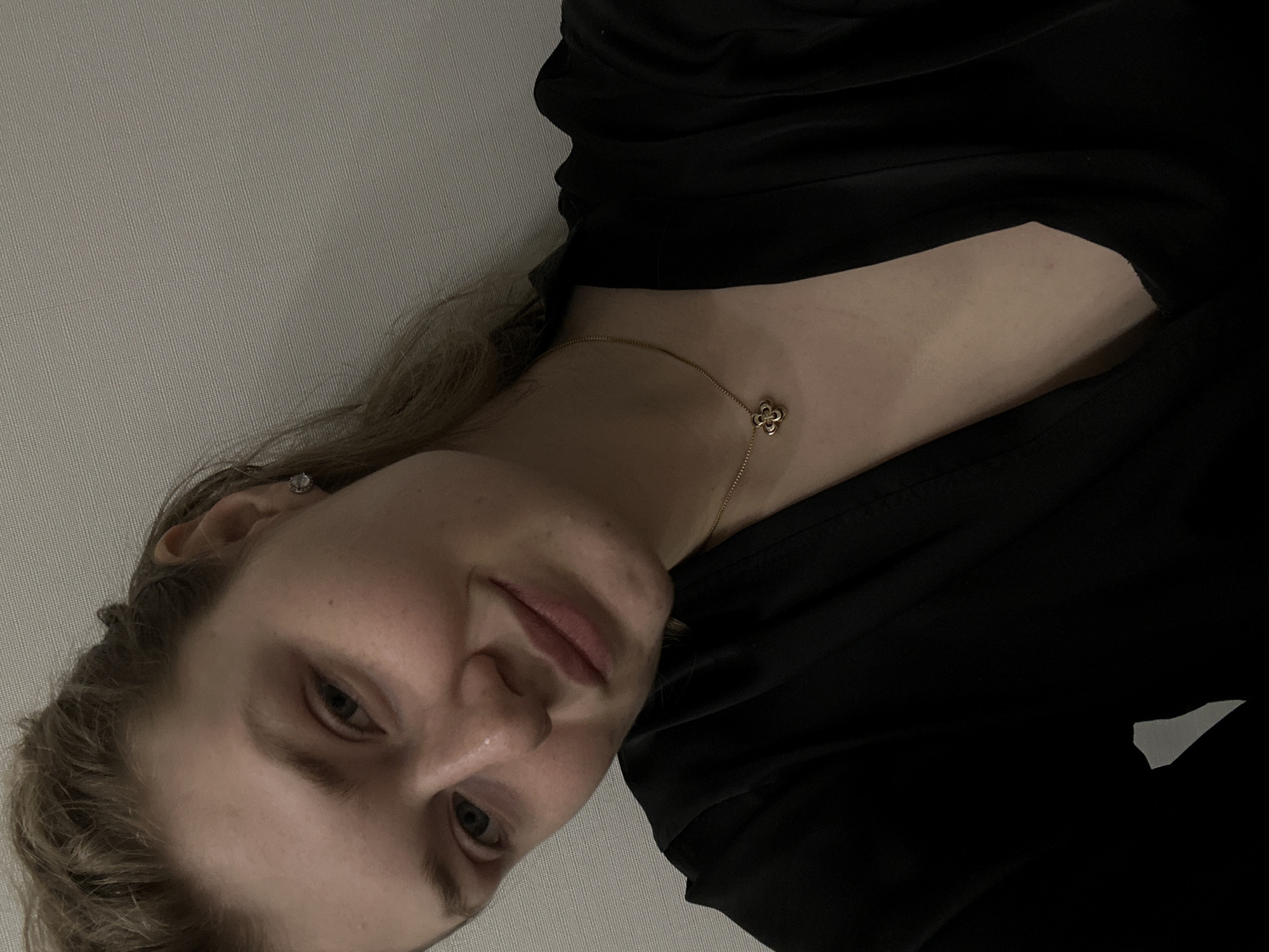 Woman in black garment, gold necklace observed in Kazan