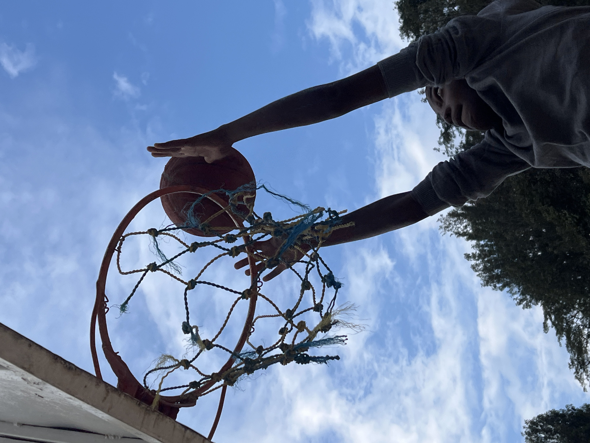 Outdoor basketball dunks at a court in Kamakwa, Kenya