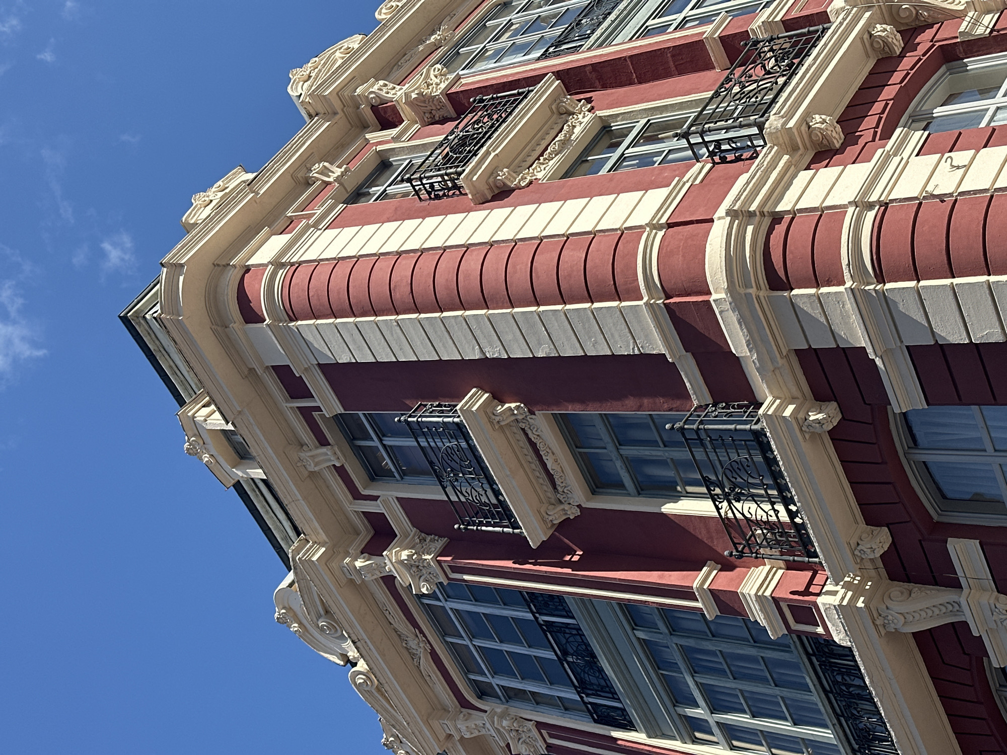 Ornate architecture documented in sunny Oviedo street scenes