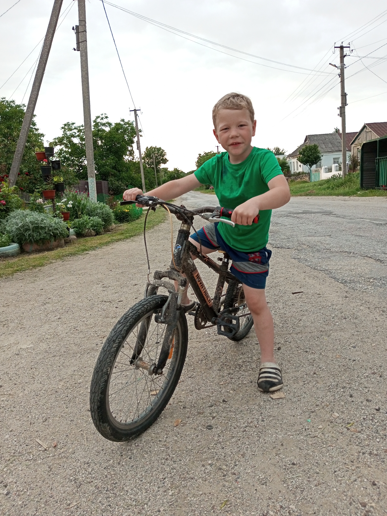 Rural Ukrainian village life with children playing and weathered streets