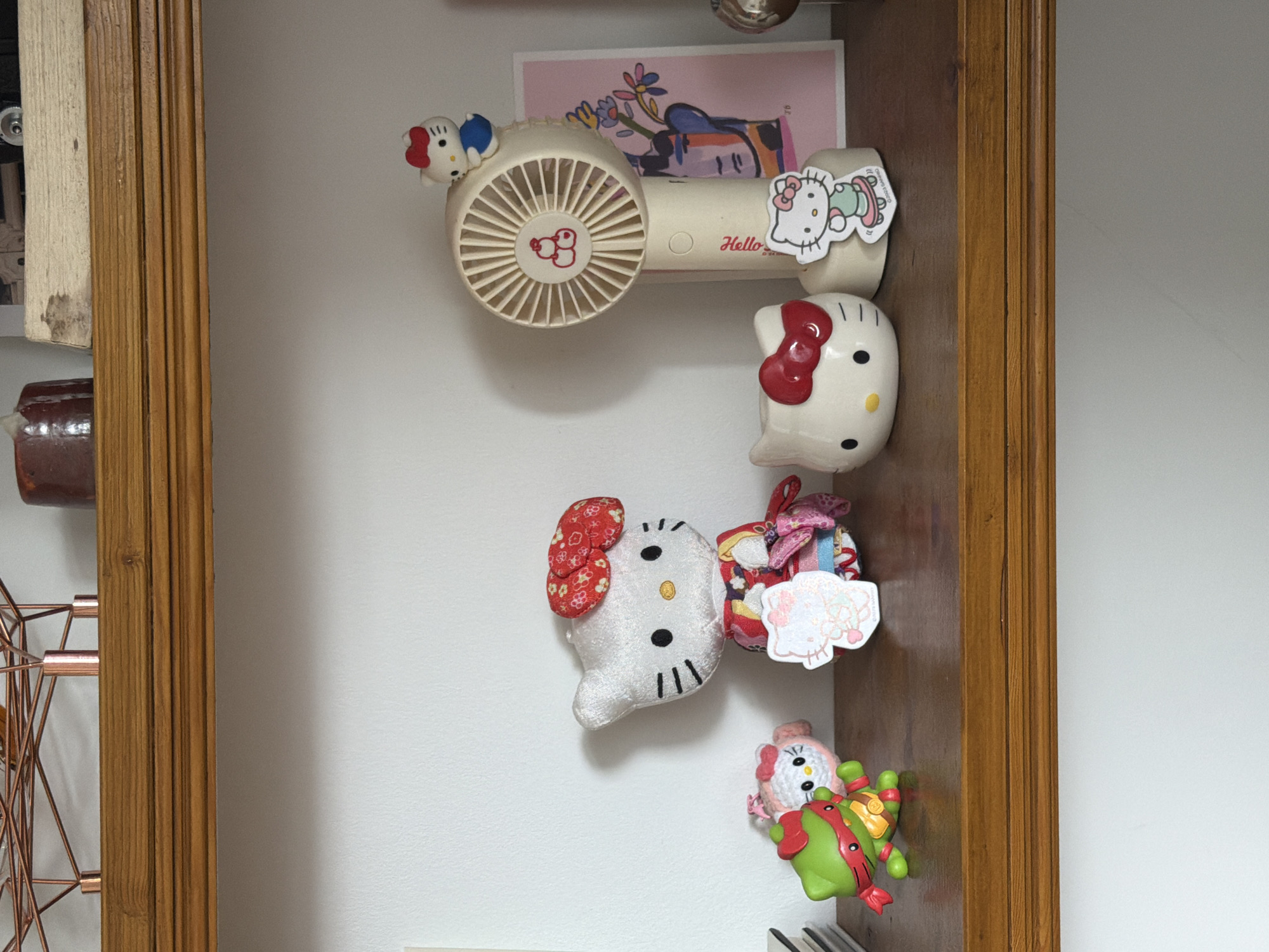 Hello Kitty items displayed in wooden frame, UK