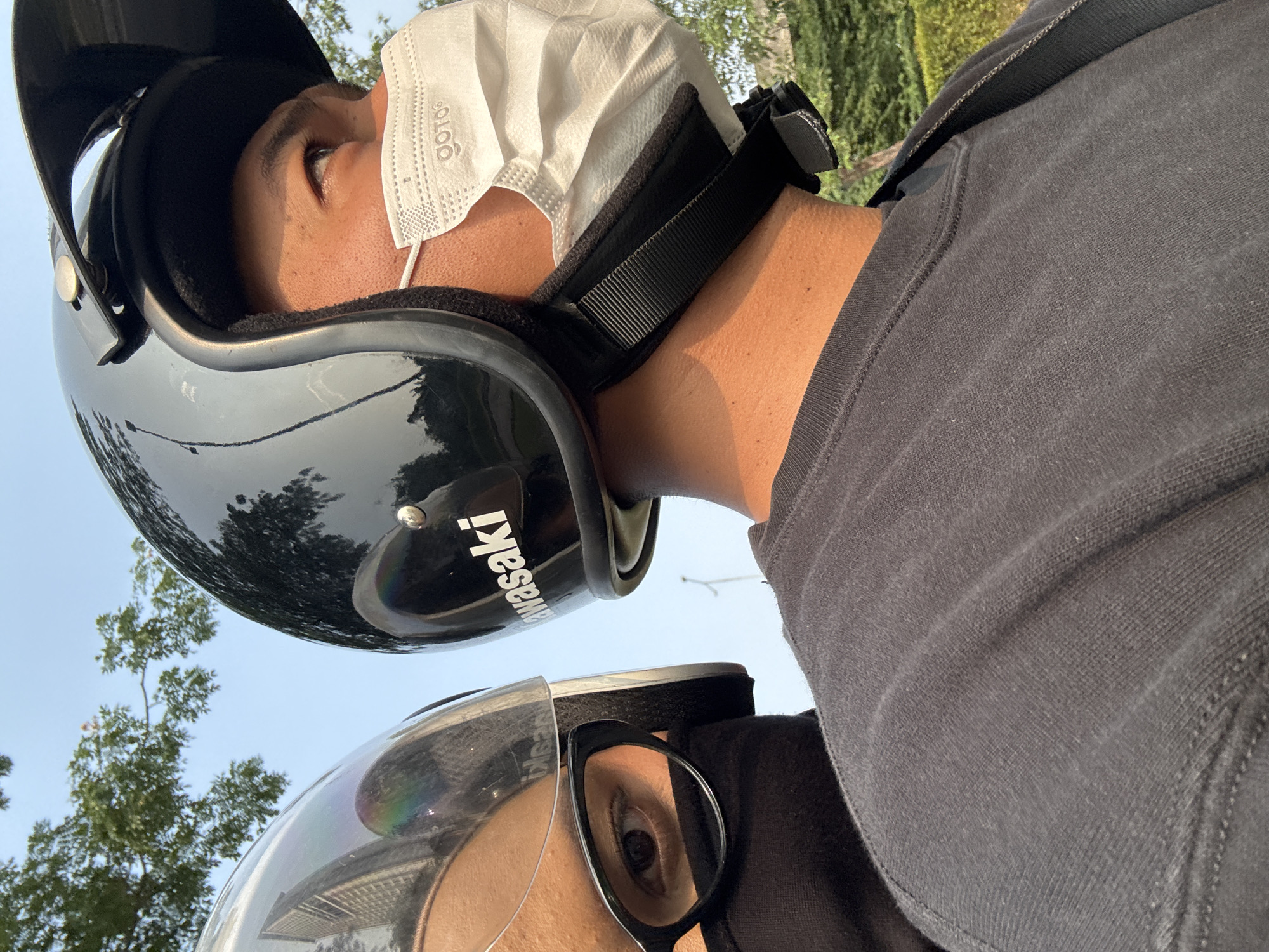 Helmeted motorcycle riders moving through South Tangerang streets