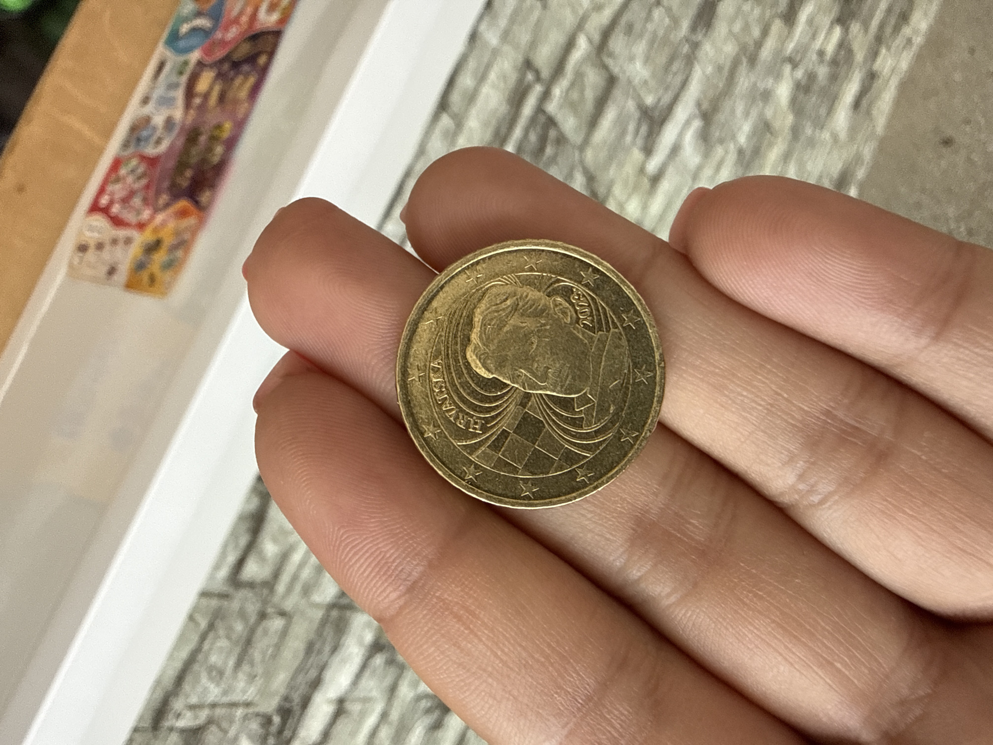 Close-up of a Croatian gold coin with classic design details