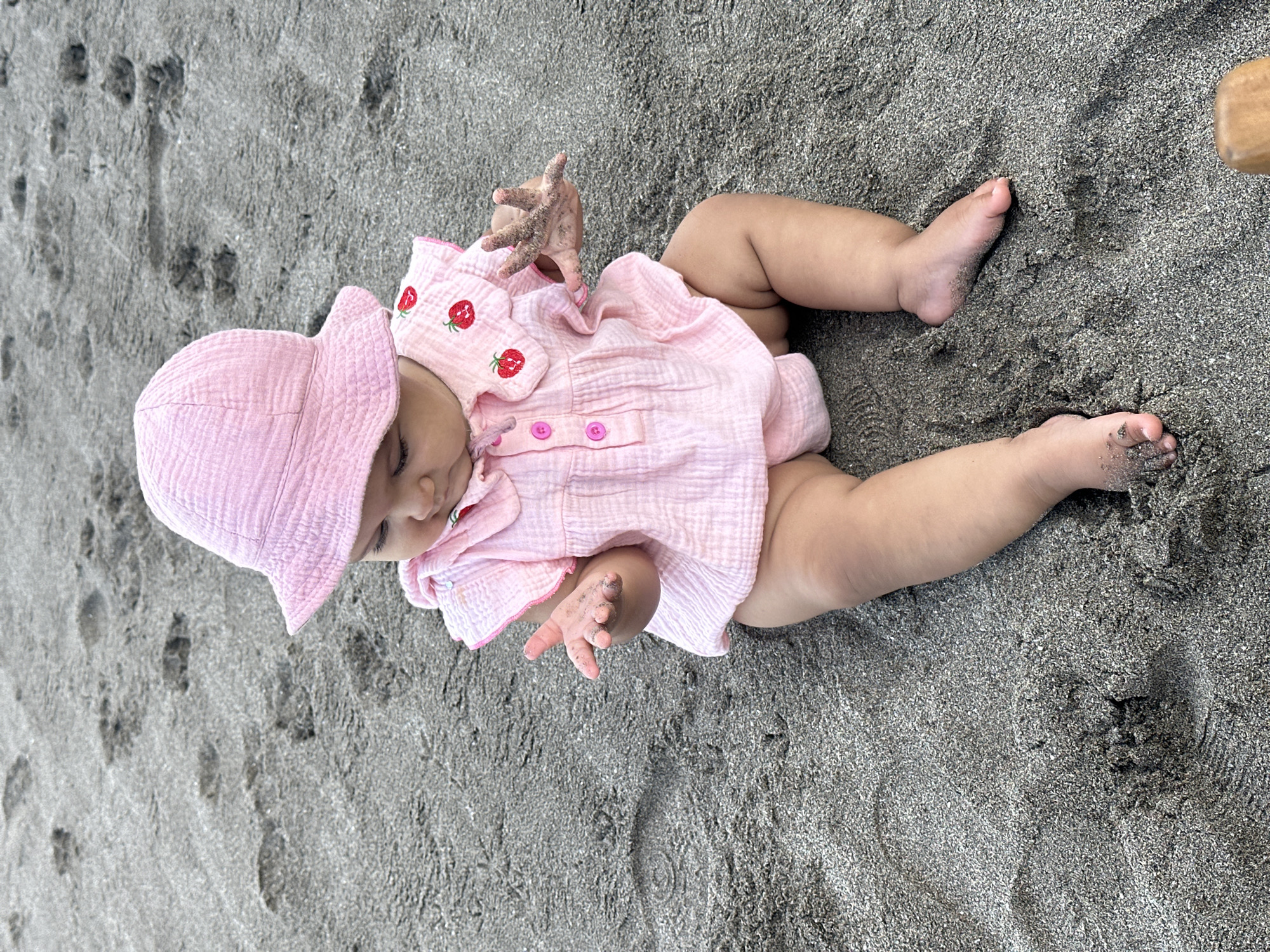 Baby and Traditional Offering Observed on North Kuta Beach