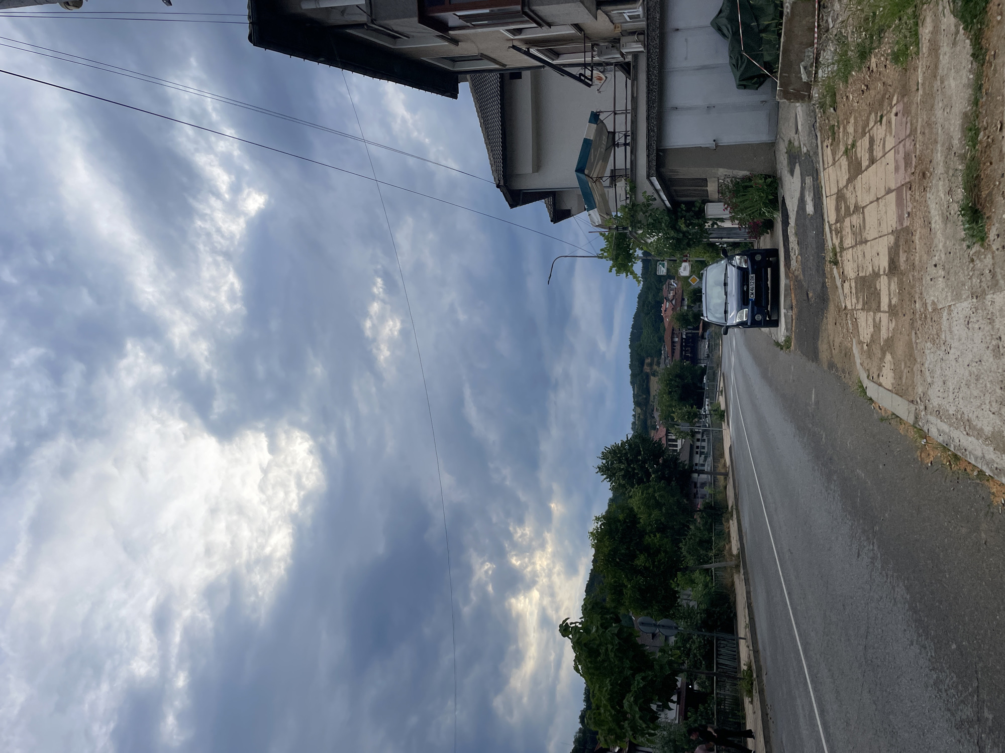 Street-level views of Zlatograd under a cloudy July sky