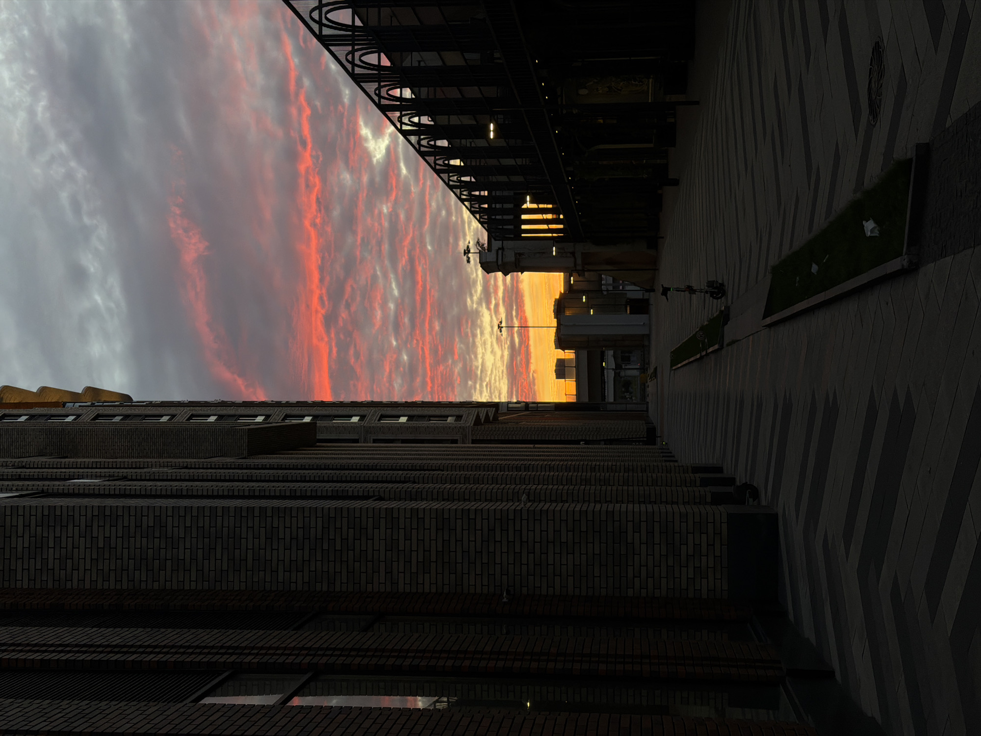 Dusk falls between modern brick buildings in Khimki, Russia