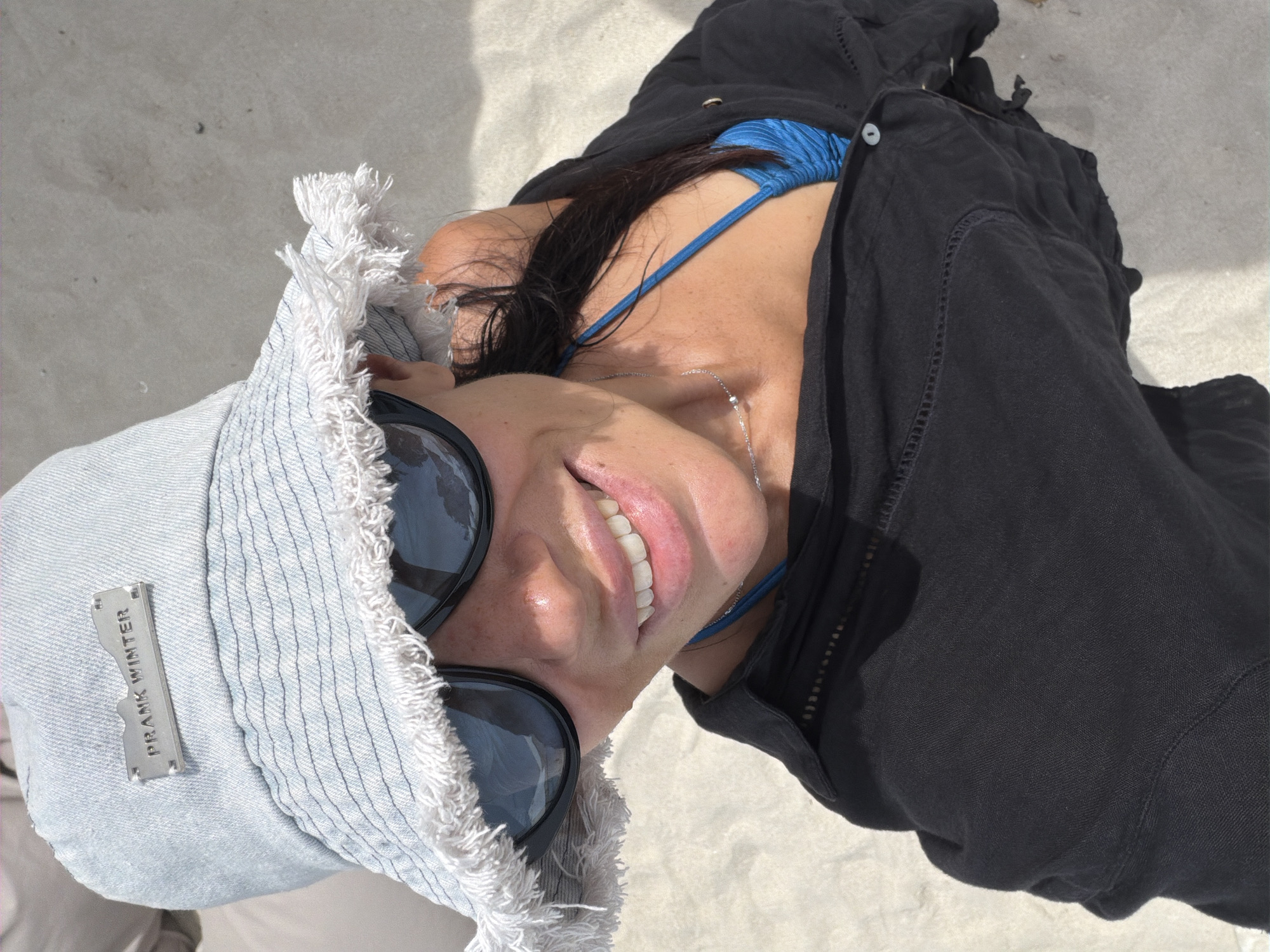 Beach selfies at Baan Chaweng in a statement bucket hat