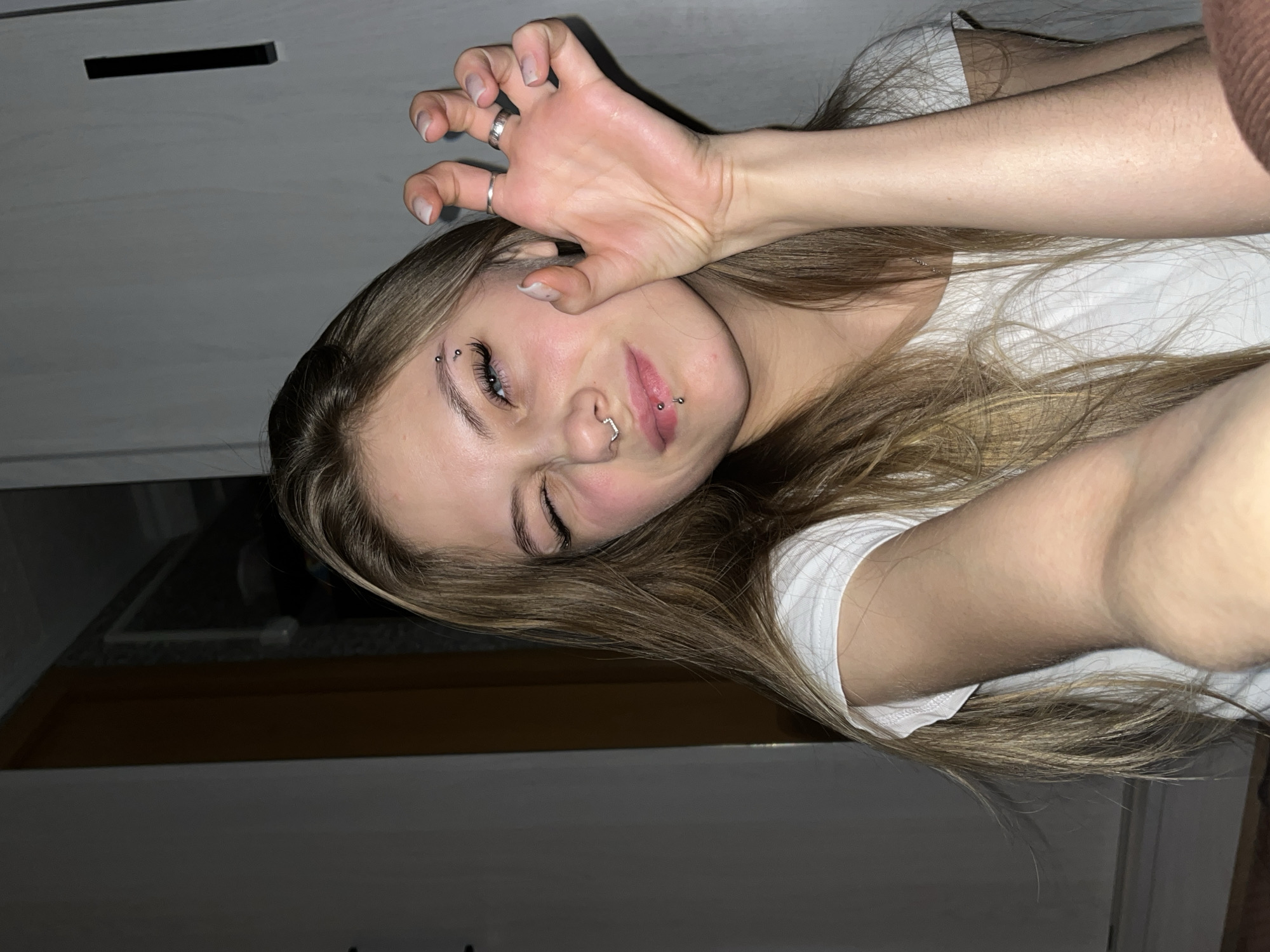 Woman takes selfie indoors in Foki, Russia