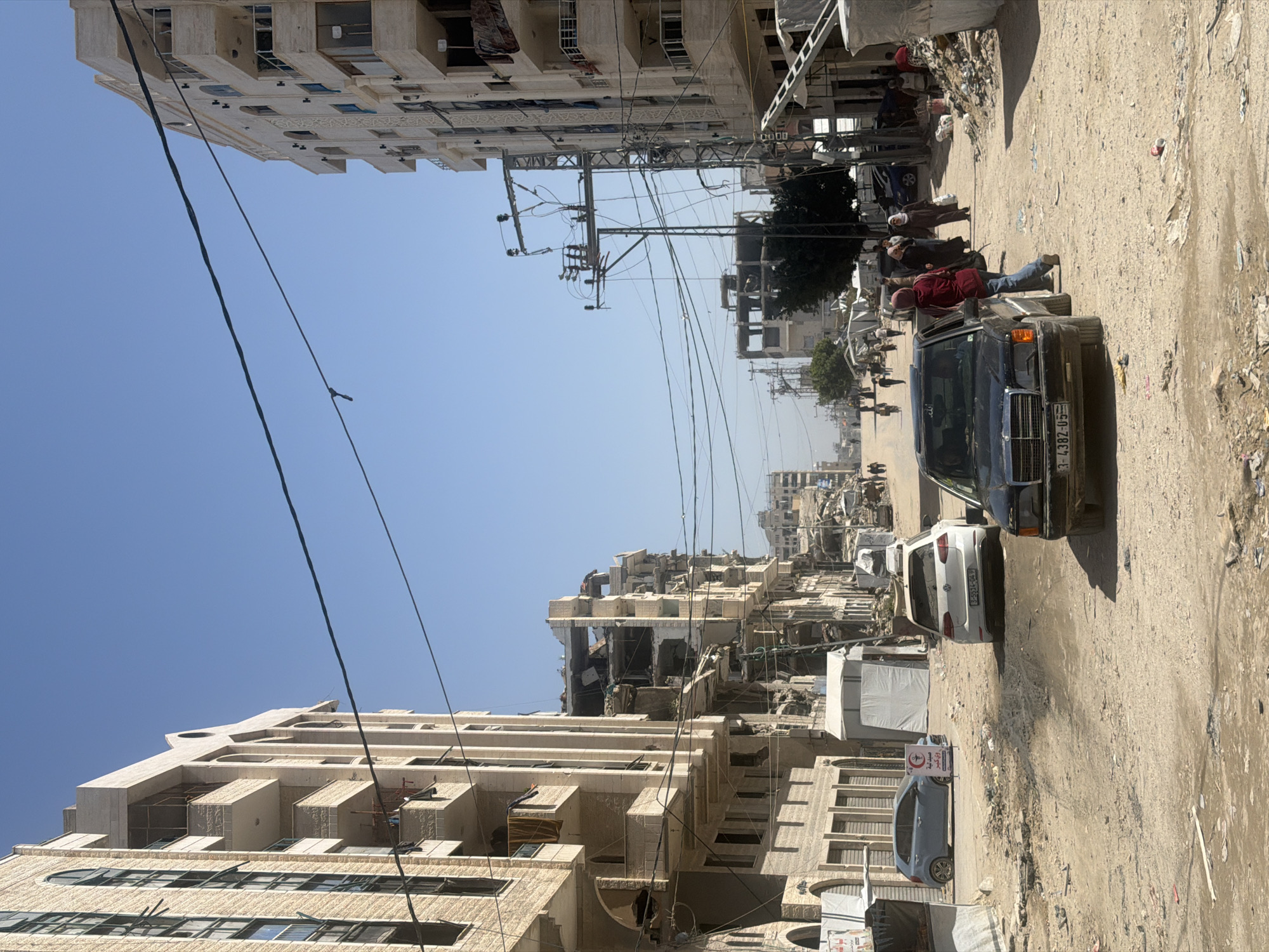 Gaza street shows damaged buildings, scattered debris