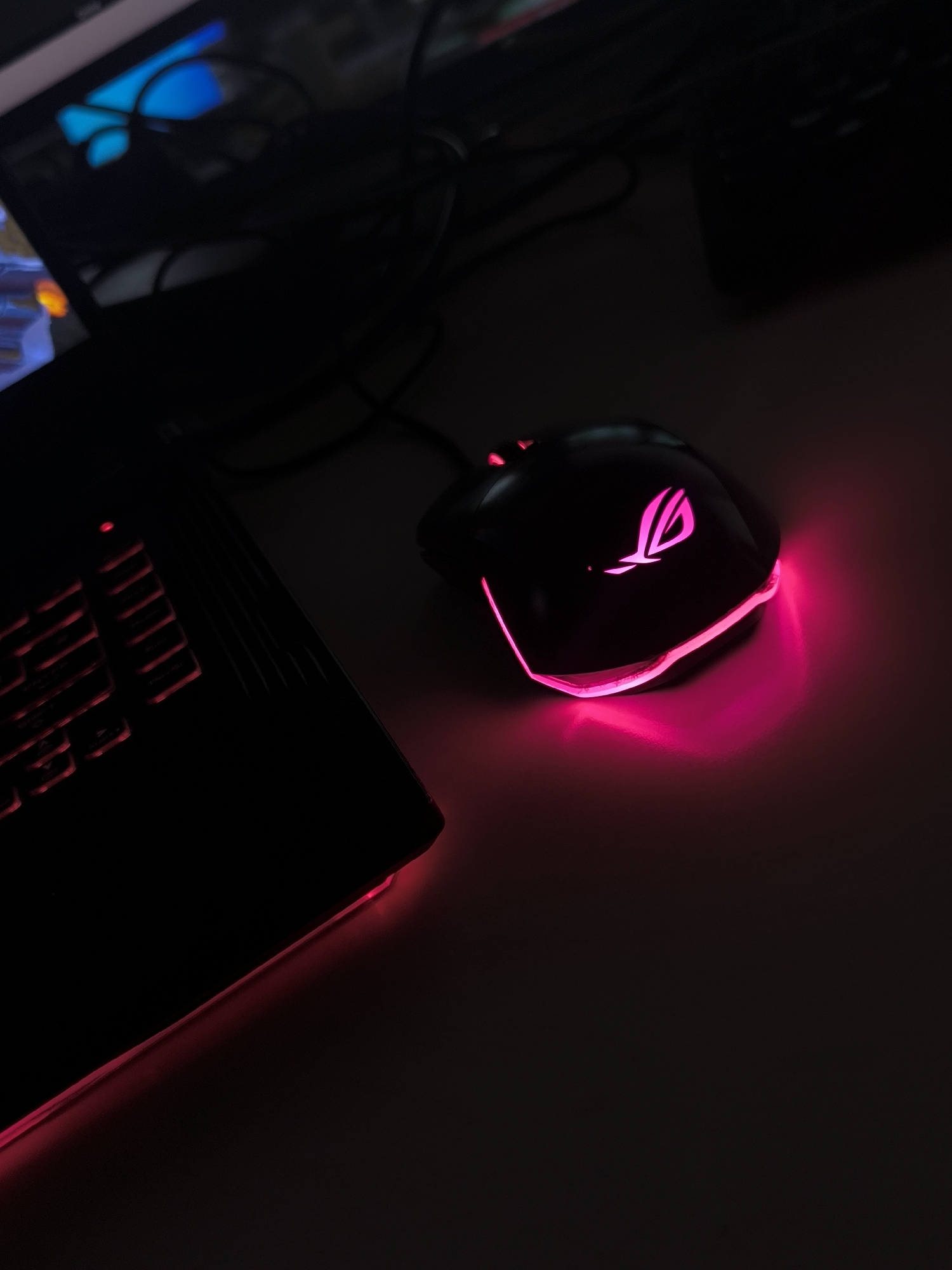 Gaming setup with pink RGB lighting captured in Sofia