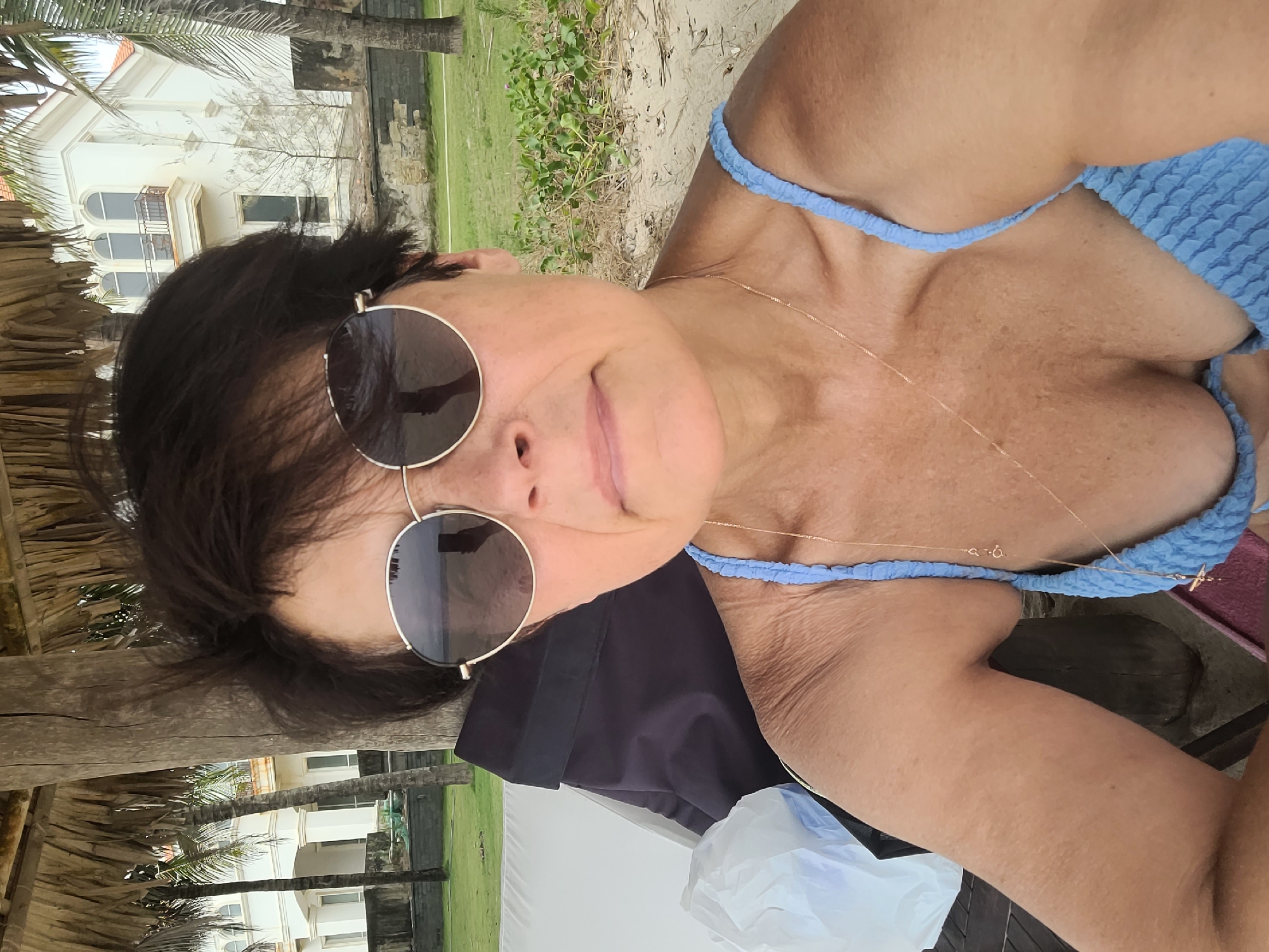 Overcast morning at Da Nang beach, surfing and paddleboarding underway