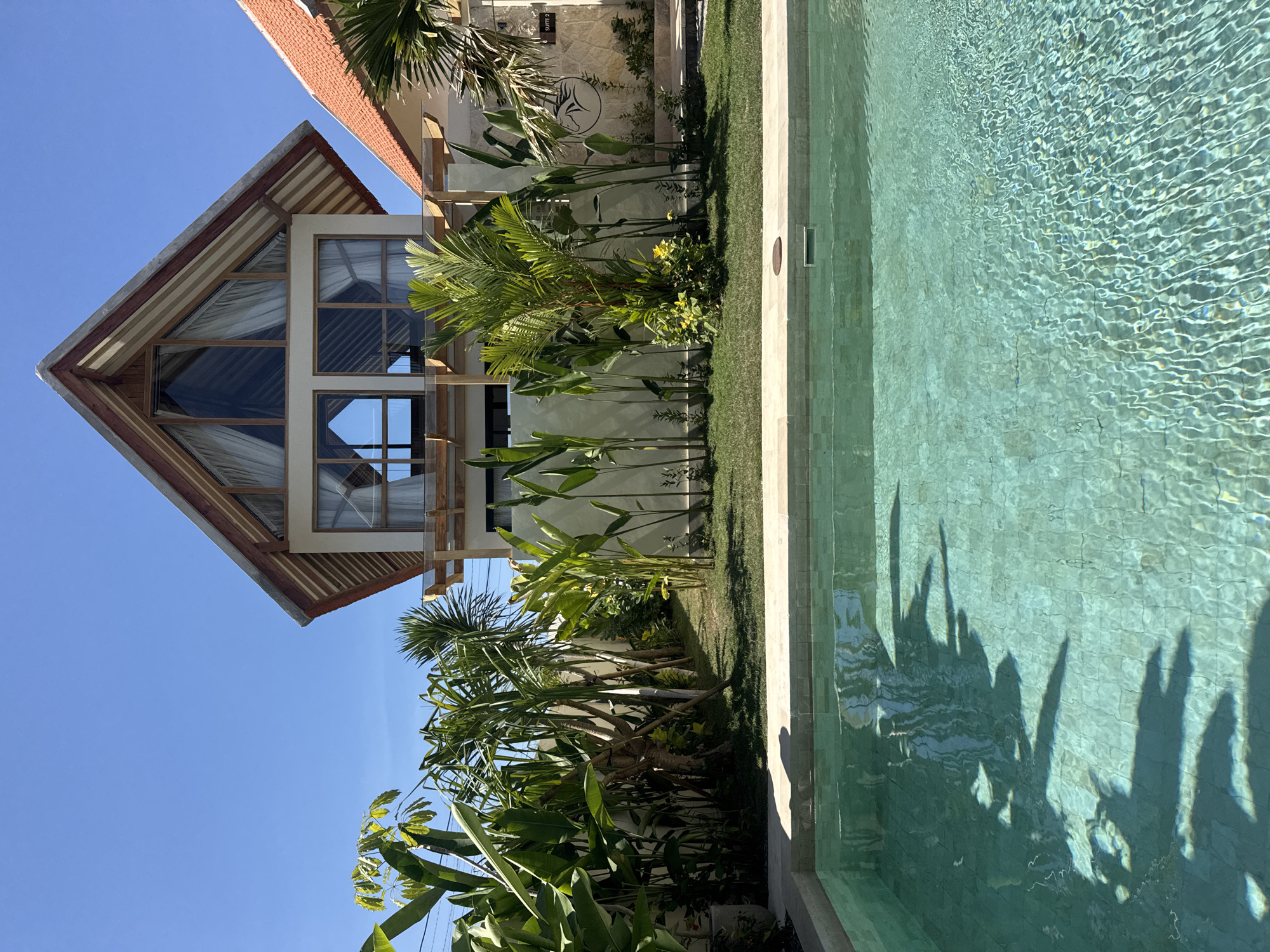 Lazy afternoon by a turquoise villa pool in Kuta Selatan