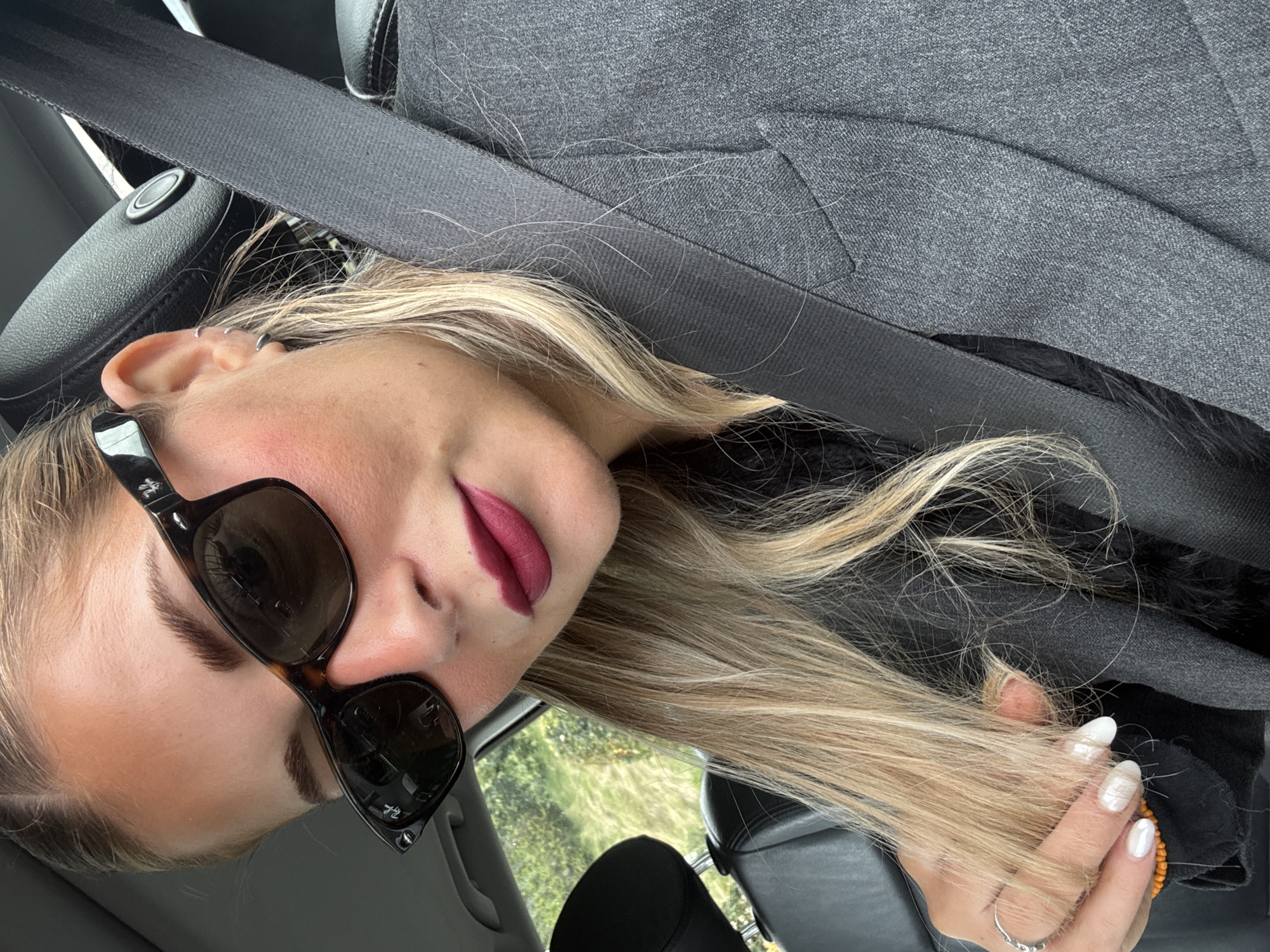 Woman in car captured in portraits in Wattrelos