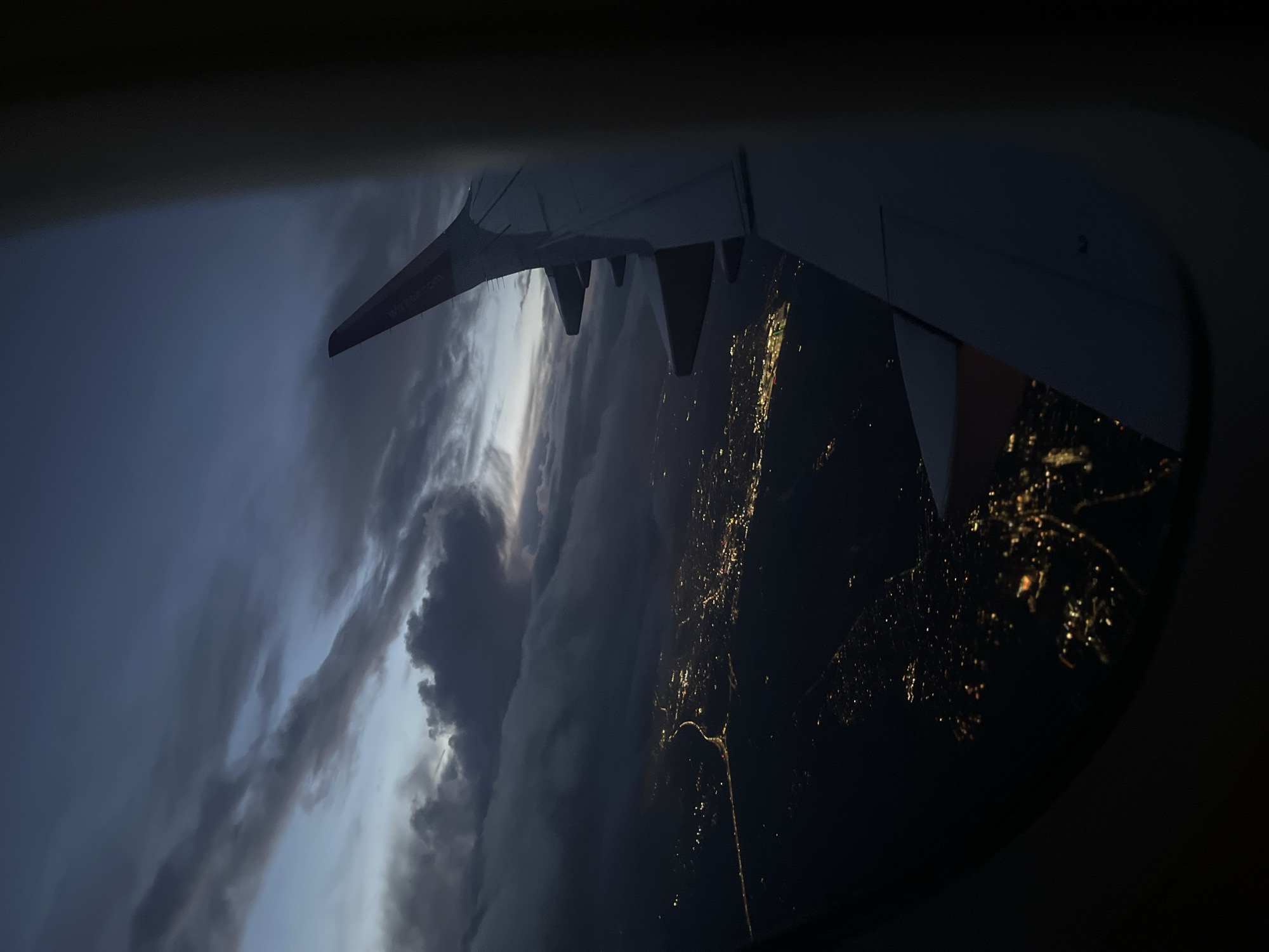 Airplane passenger captures aerial view over St Albans evening lights
