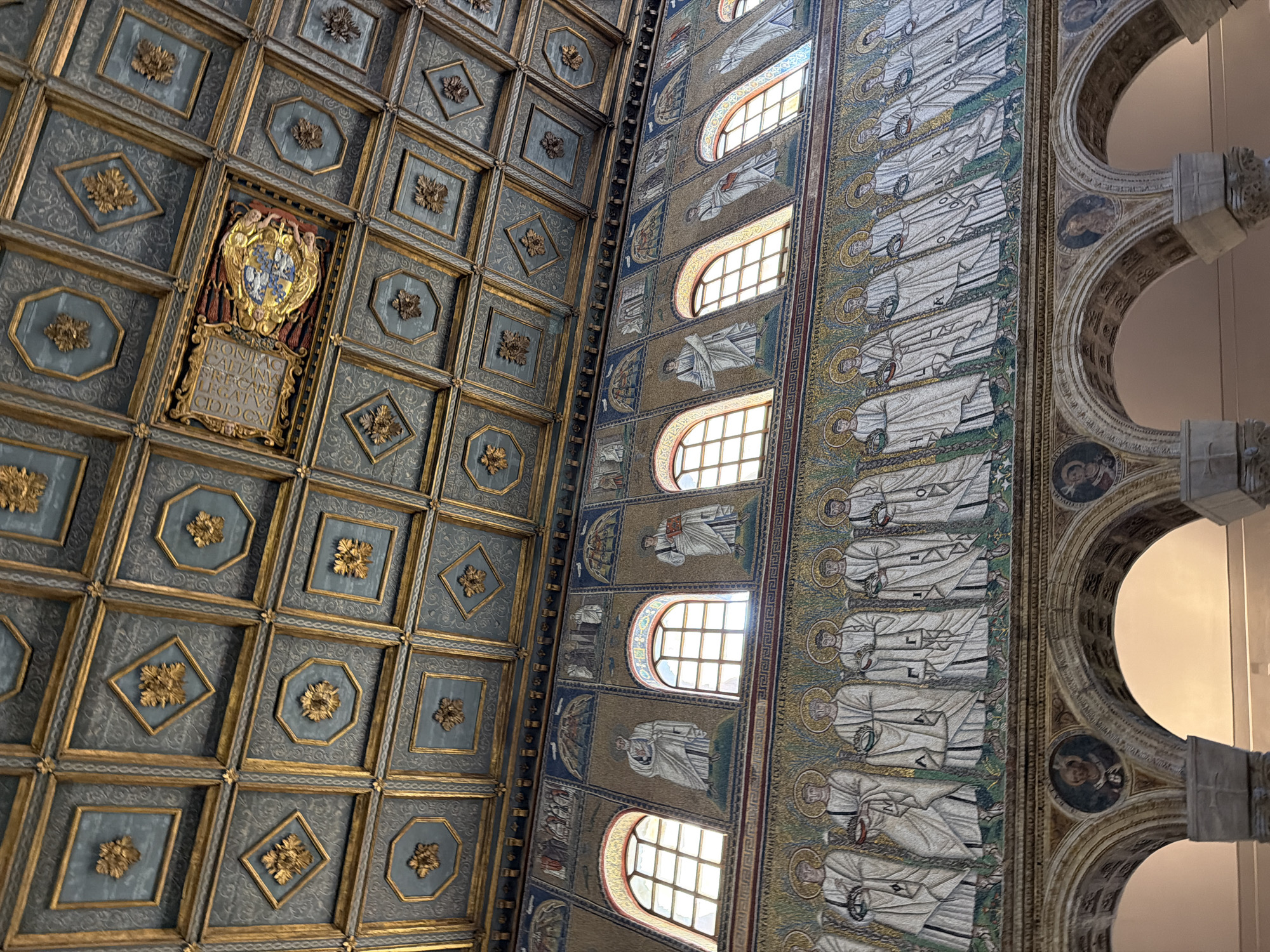 Visitor documents historic Basilica di Sant'Apollinare Nuovo interiors in Ravenna