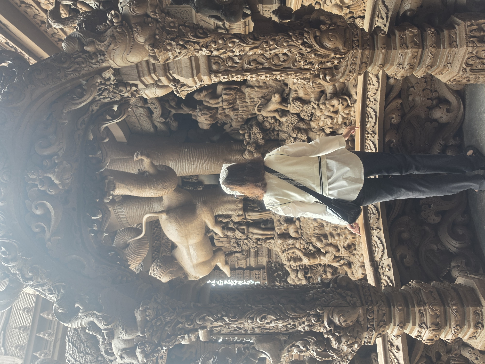 Tourist explores Pattaya's Sanctuary of Truth and attractions