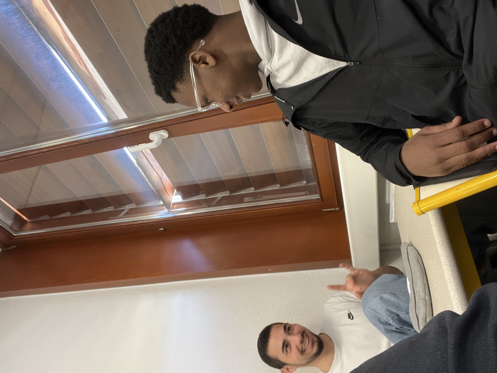 Young men take selfies during casual meetup in Schiltigheim