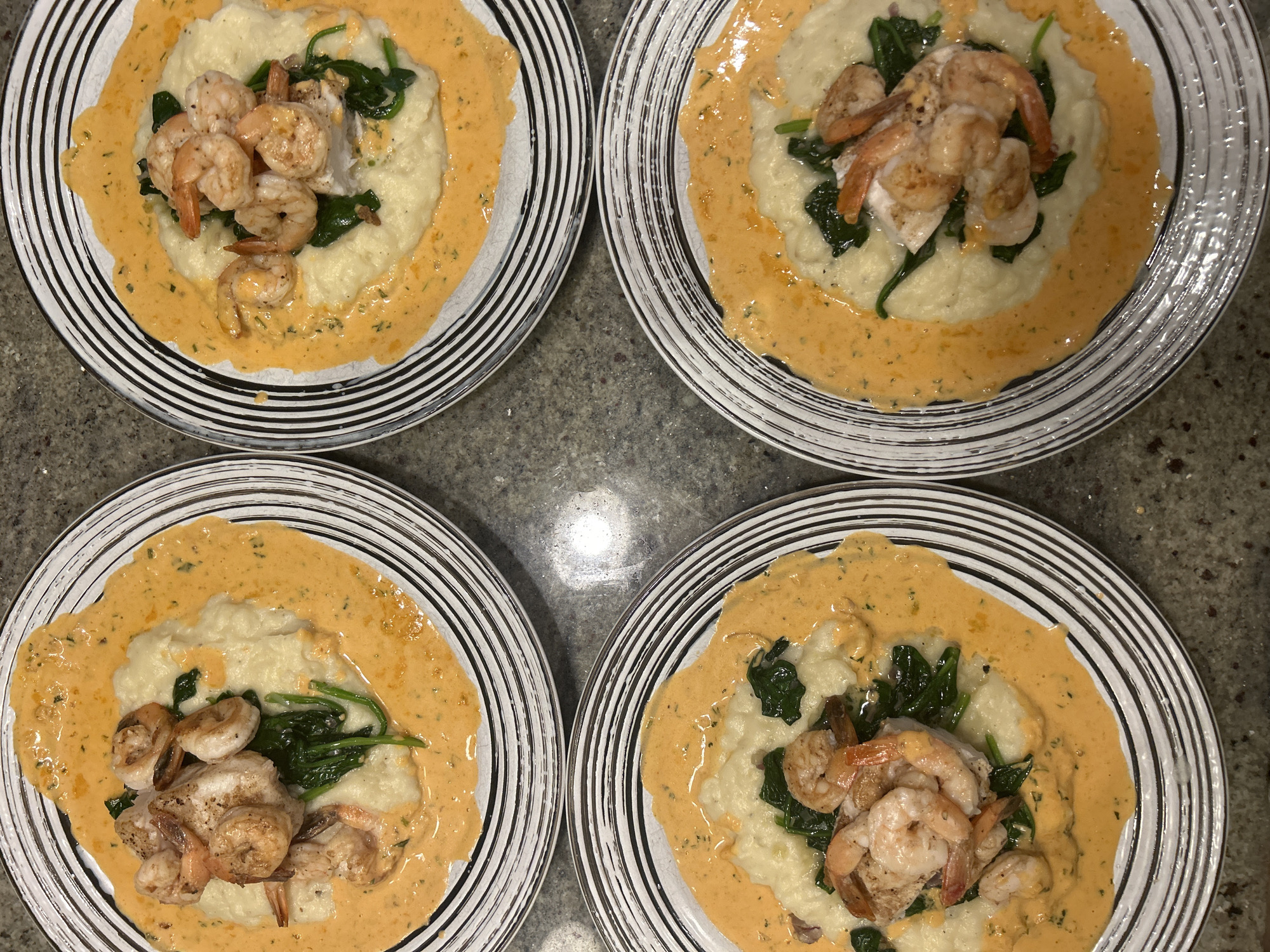 Four identical plated meals documented in Whistler dining setting