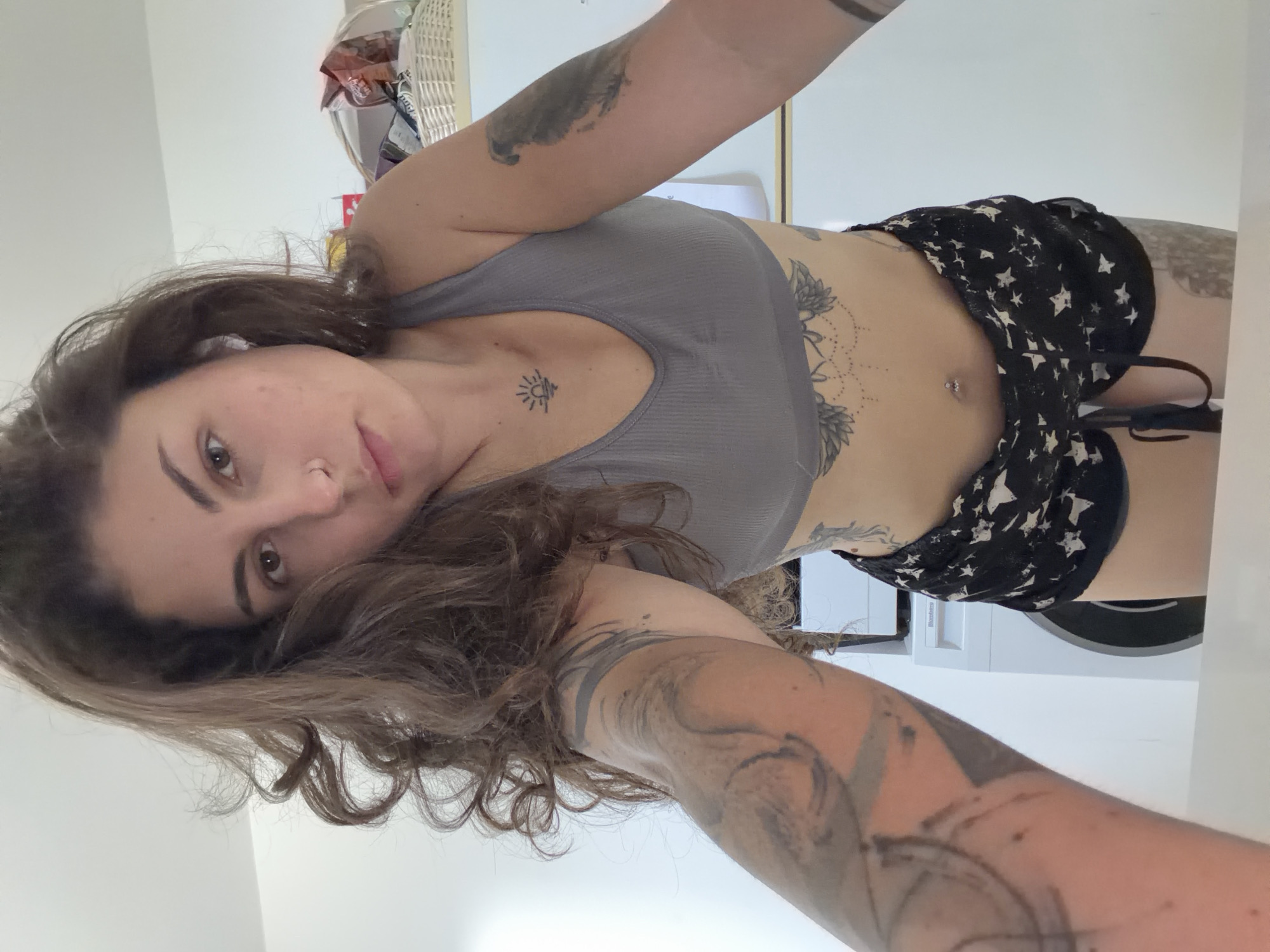 Woman records fitness video in kitchen, Kiryat Bialik