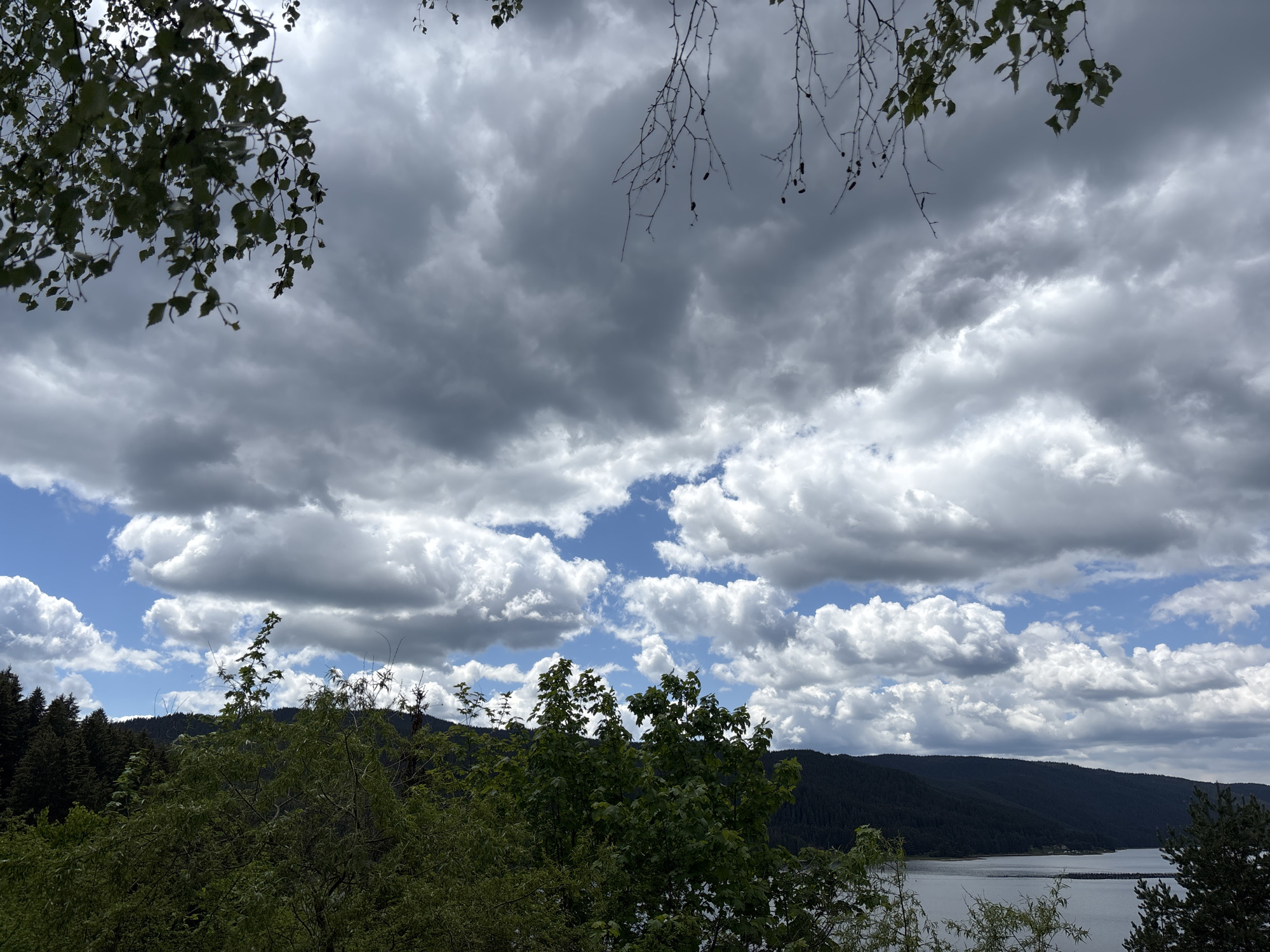 Scenic Lake Dospat landscape captured under changing skies
