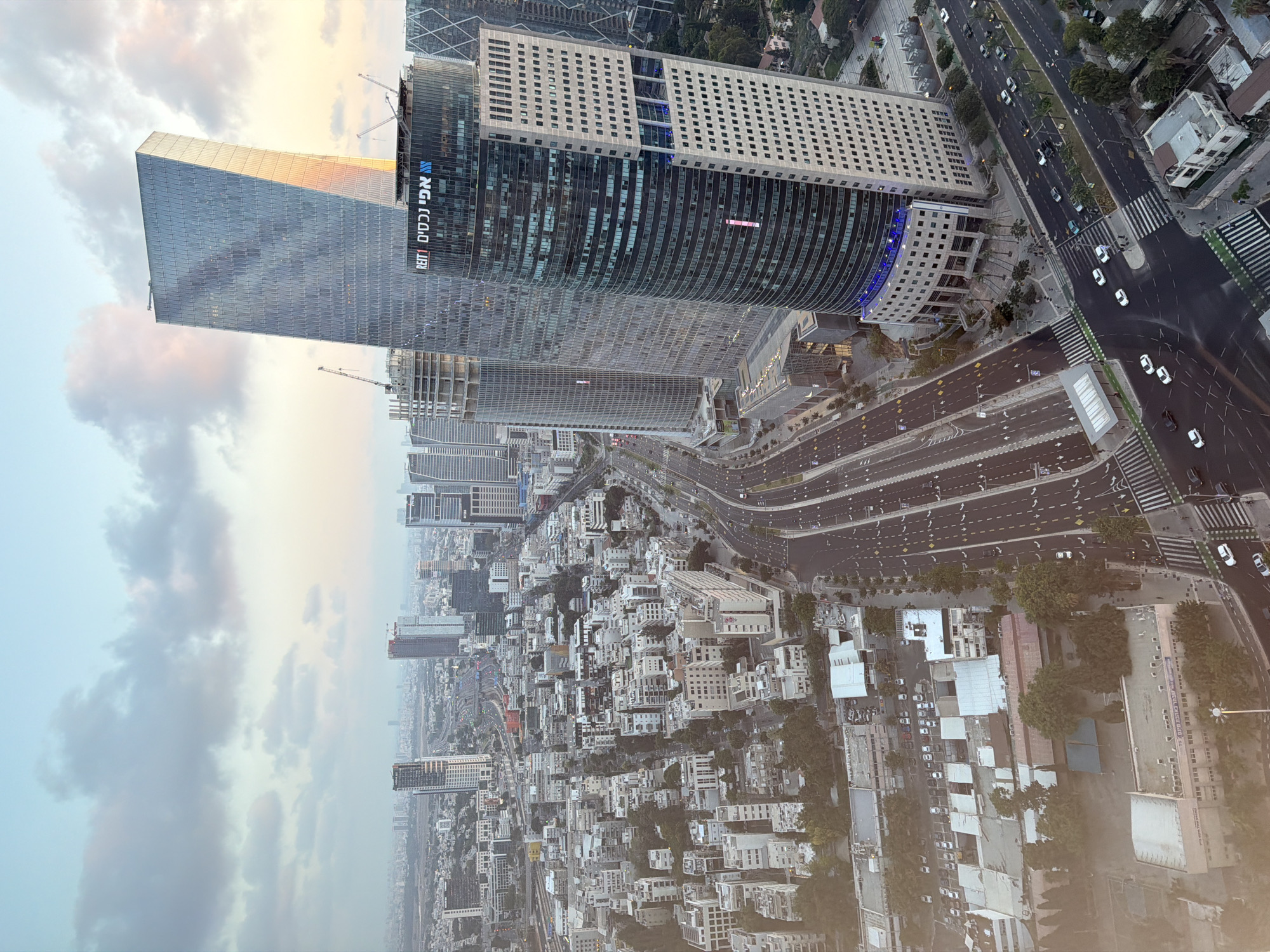 Tel Aviv skyline at dusk, sea and city from above