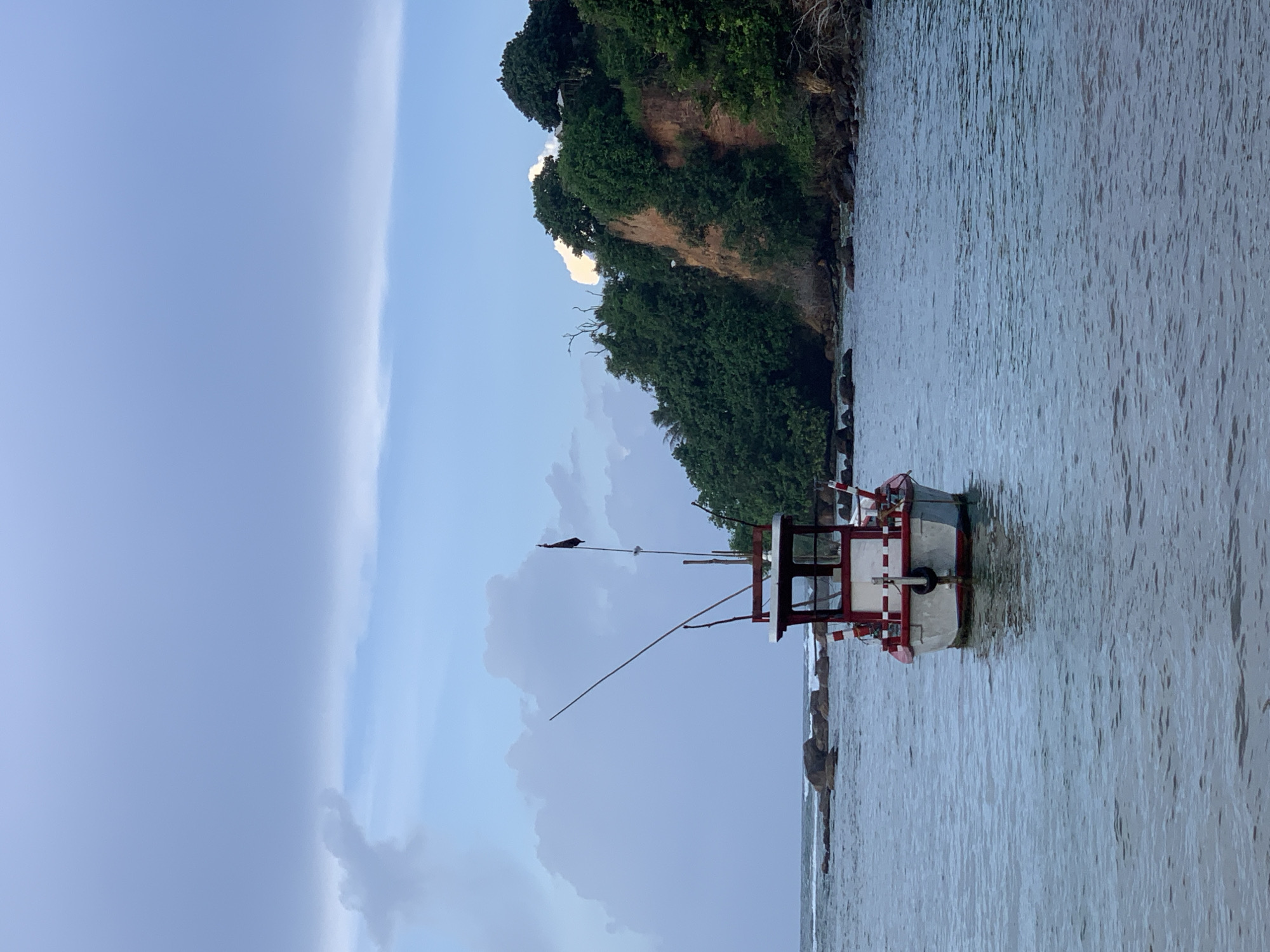 Colorful fishing boats rest in calm Mirissa waters overnight