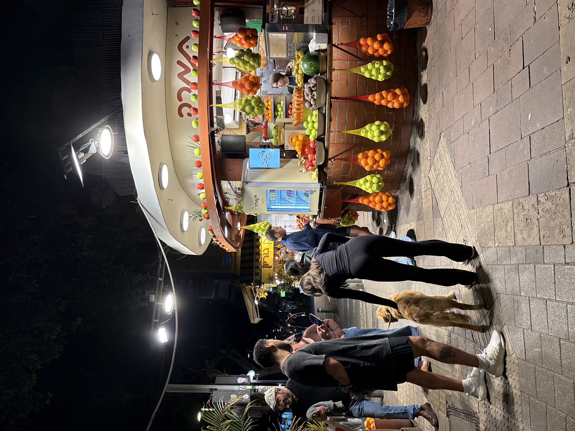 Street fruit vendor operates in Tel Aviv evening