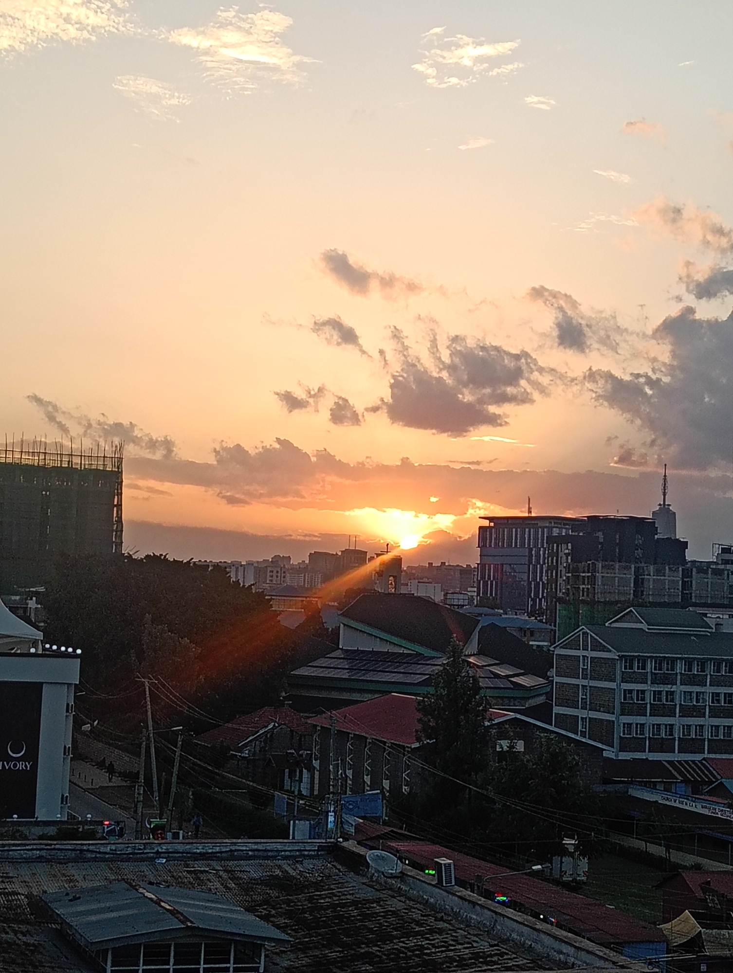 Sunset scenes captured across Nairobi rooftops and neighborhoods
