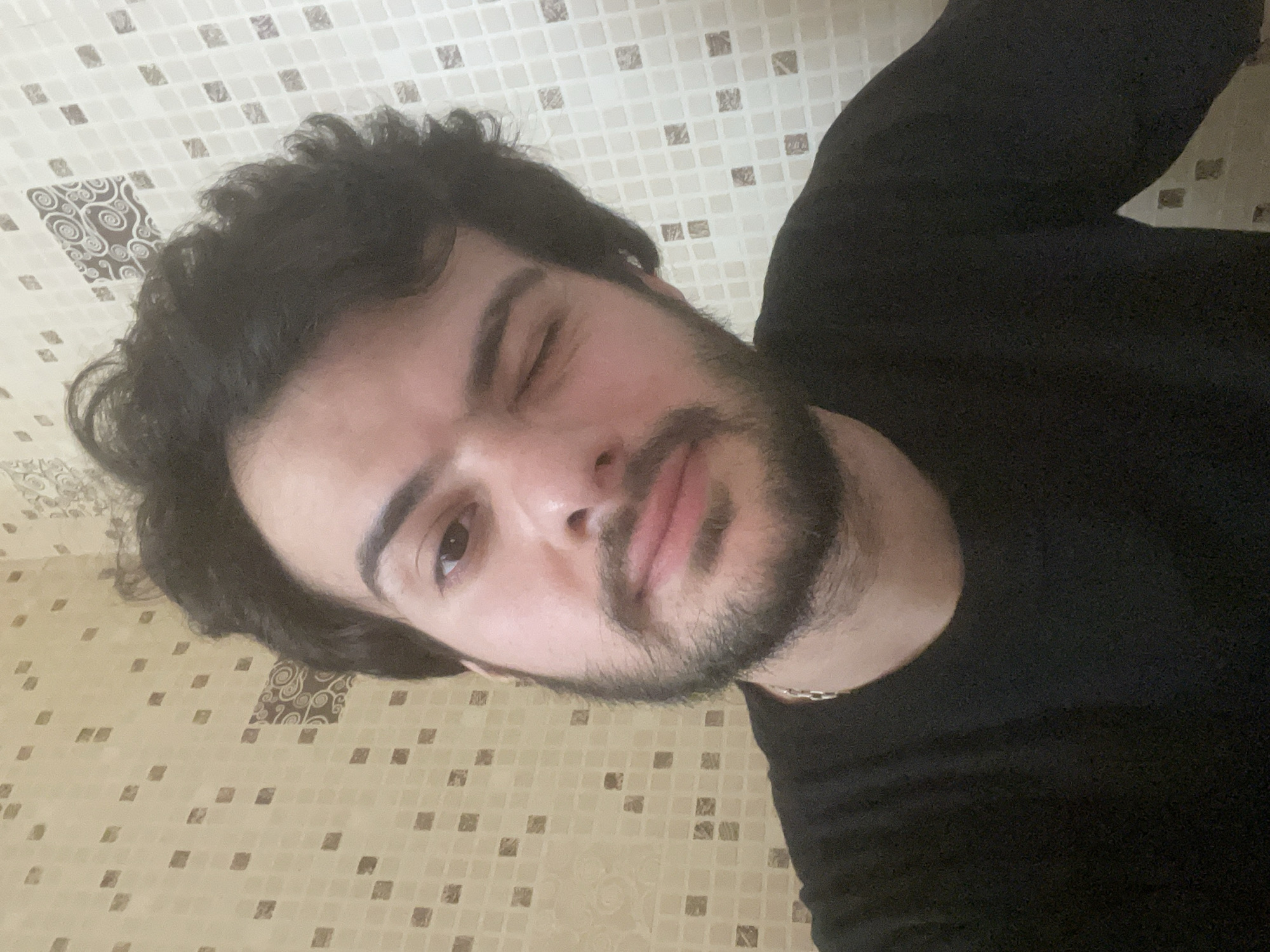 Young man documents morning routine in Tbilisi apartment