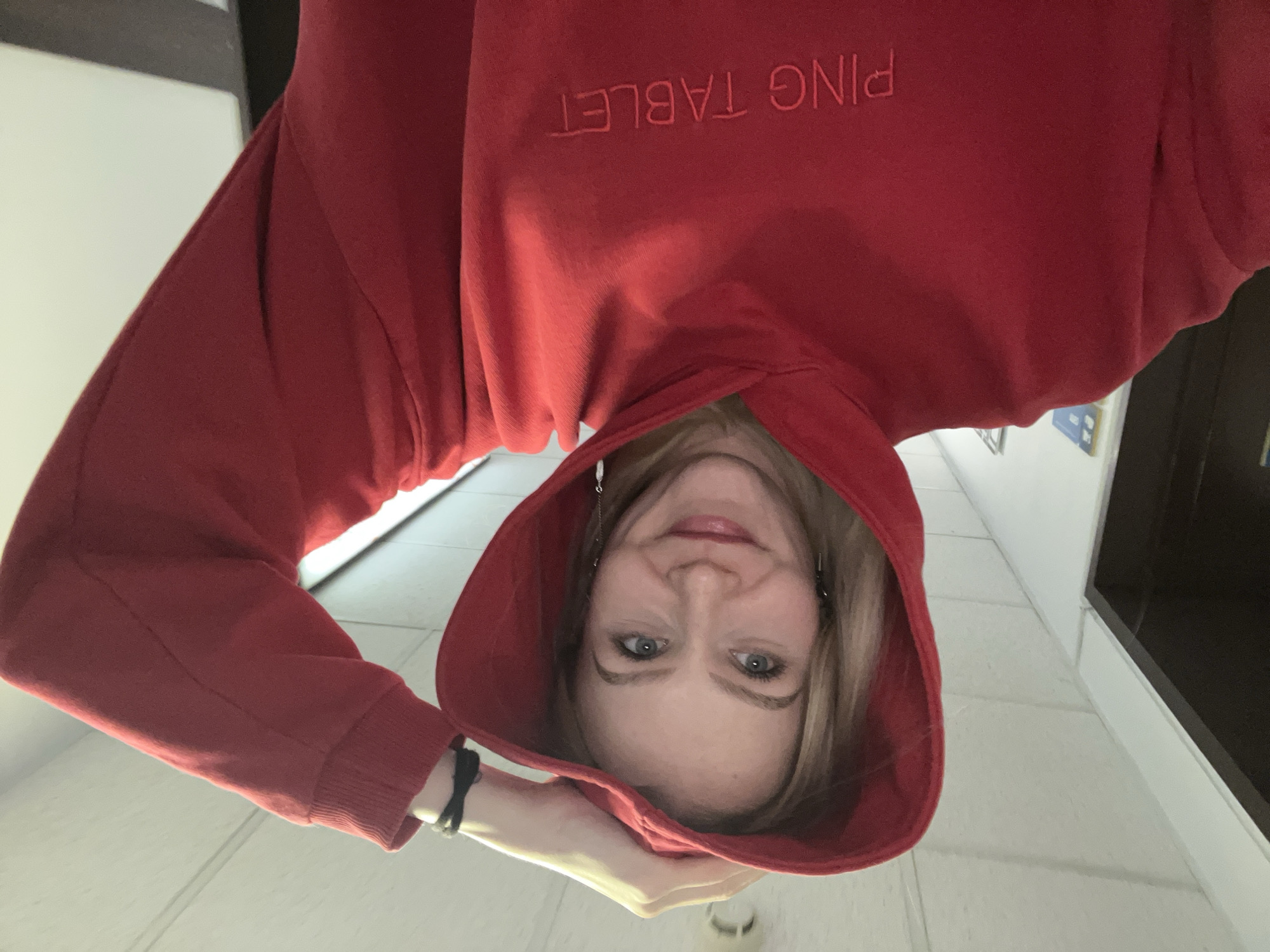 Woman in red hoodie photographed indoors in Khimki