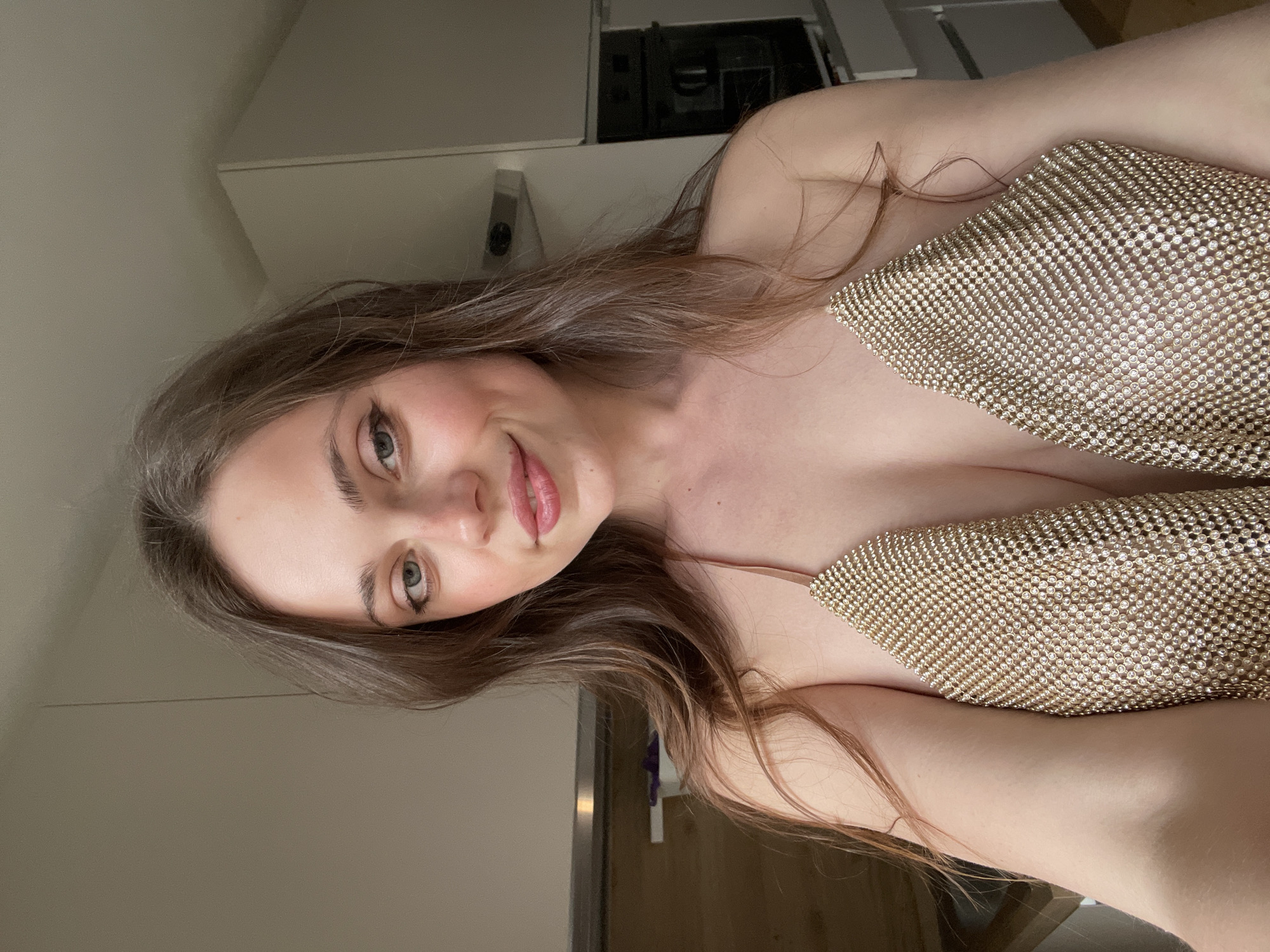 Woman takes kitchen selfie in Sappada, Italy