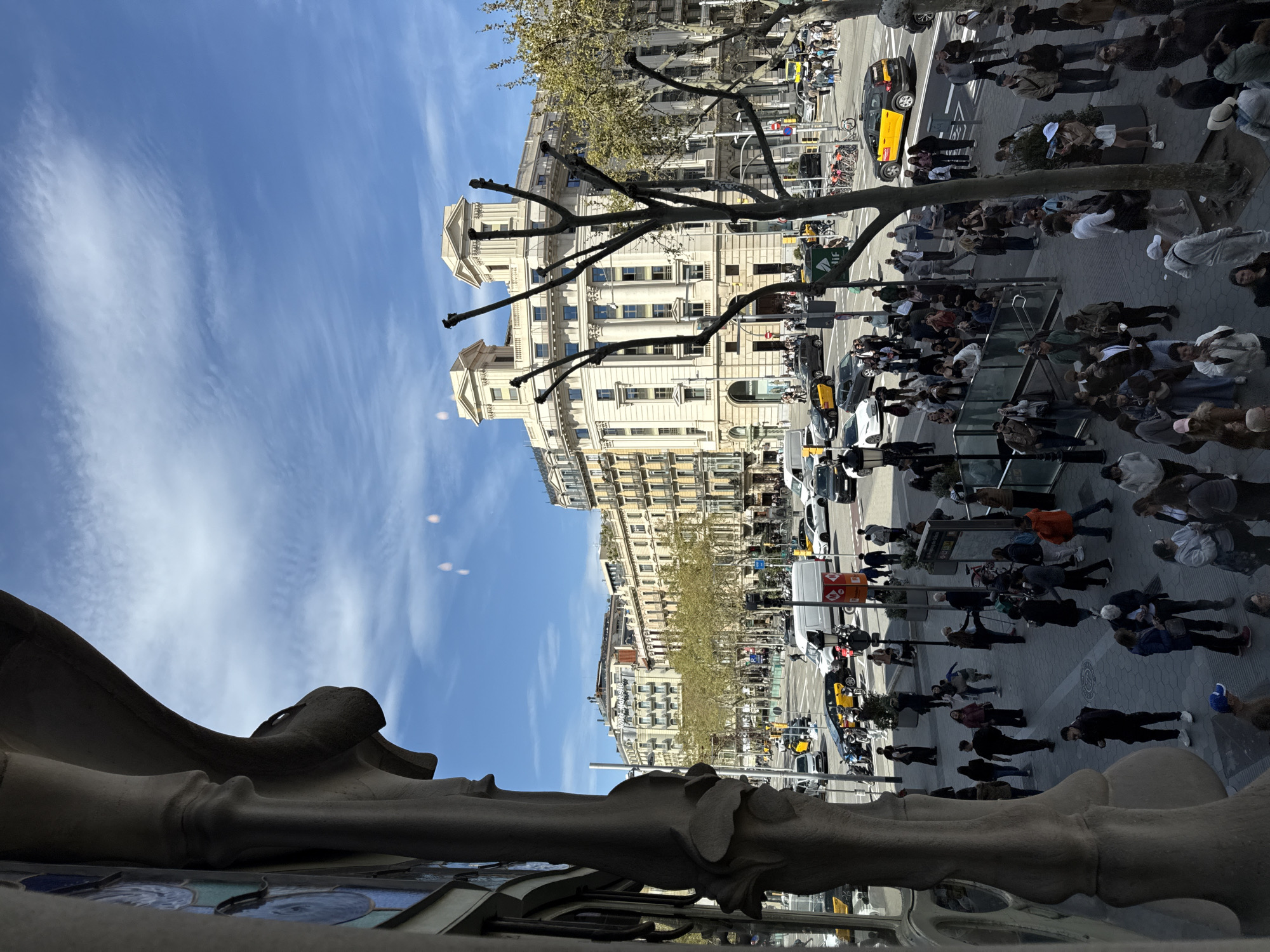 Tourist explores Gaudí landmarks in Barcelona afternoon