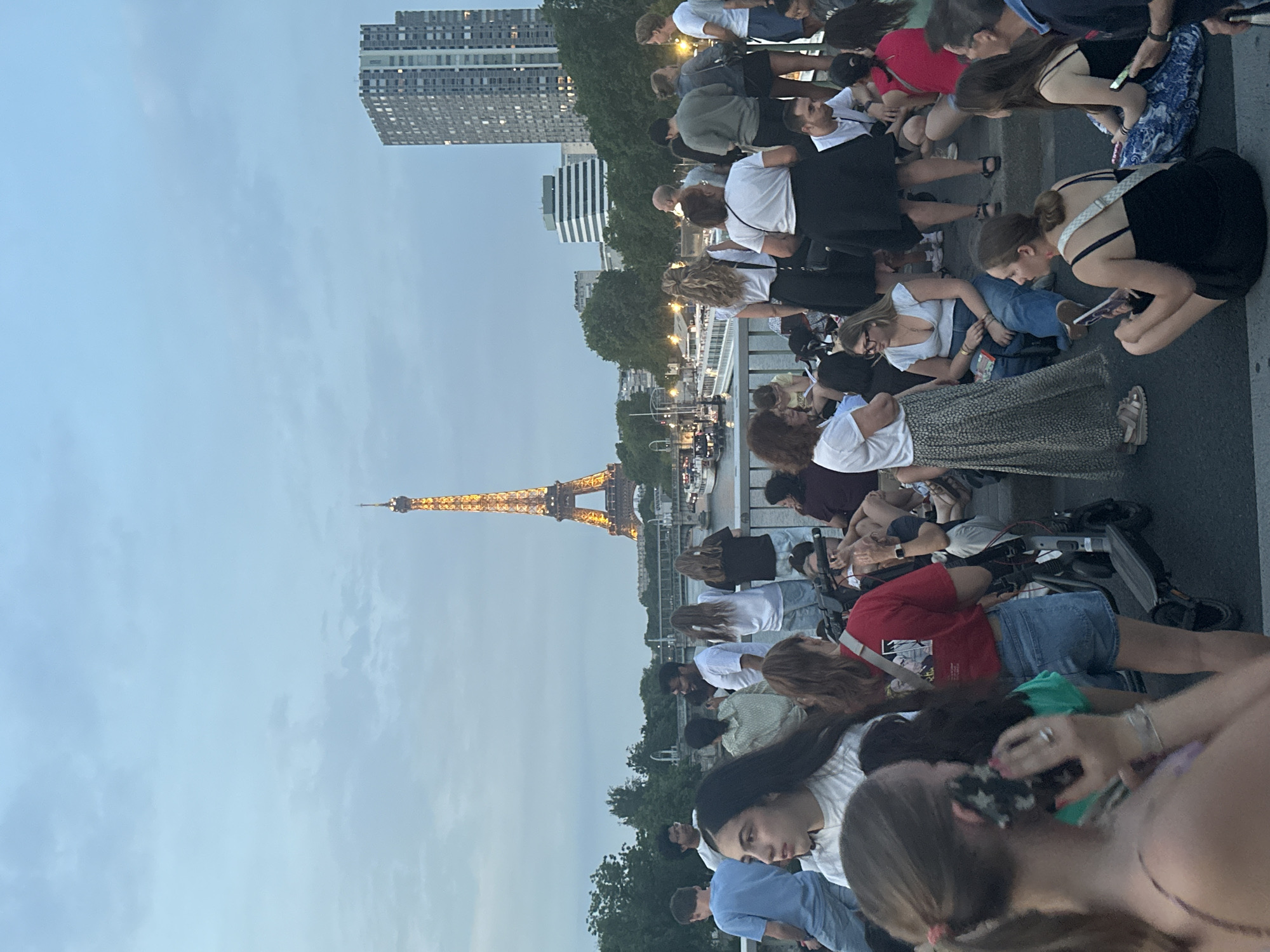 Paris crowds gather along the Seine on Bastille Day eve