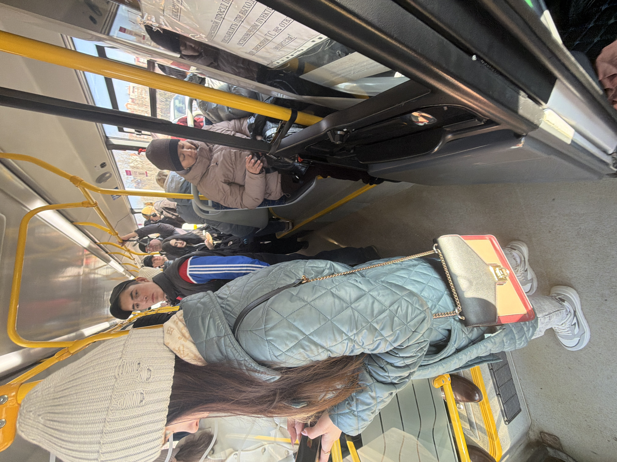 Woman in winter clothing observed on Krasnoyarsk city bus