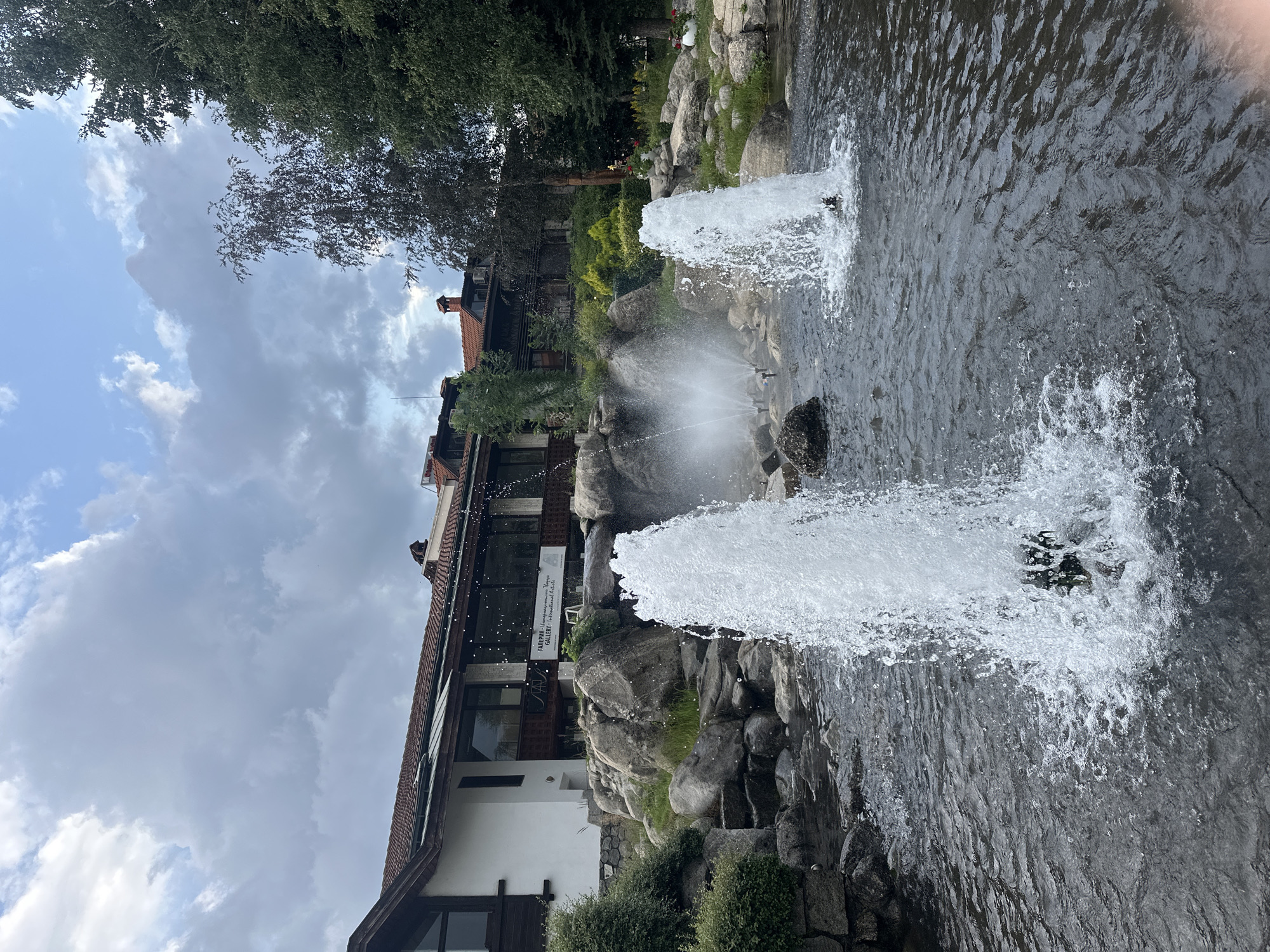 Bansko old town: fountains, stone houses, and a piano planter