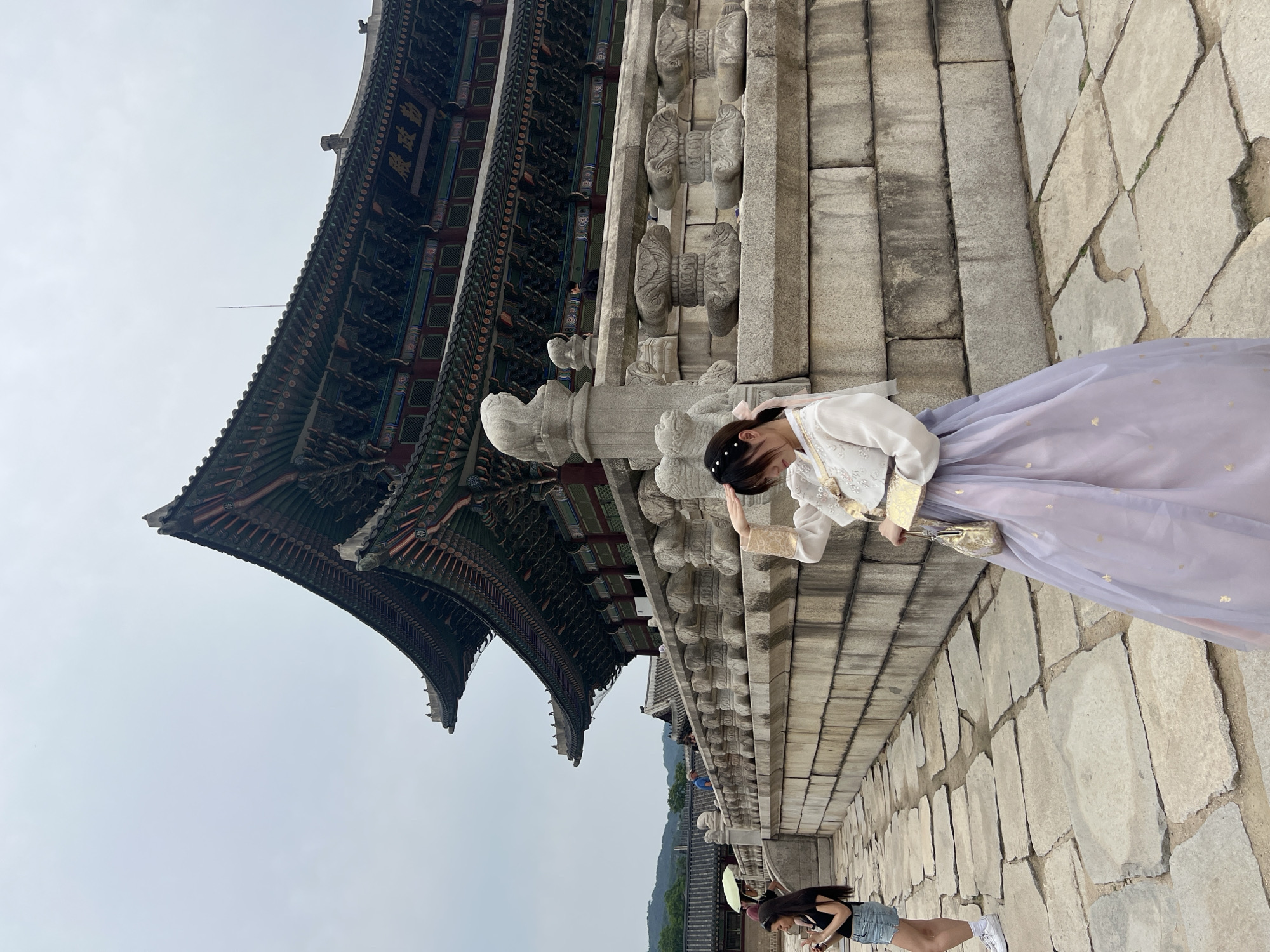Traditional dress worn at Seoul palace during overcast morning