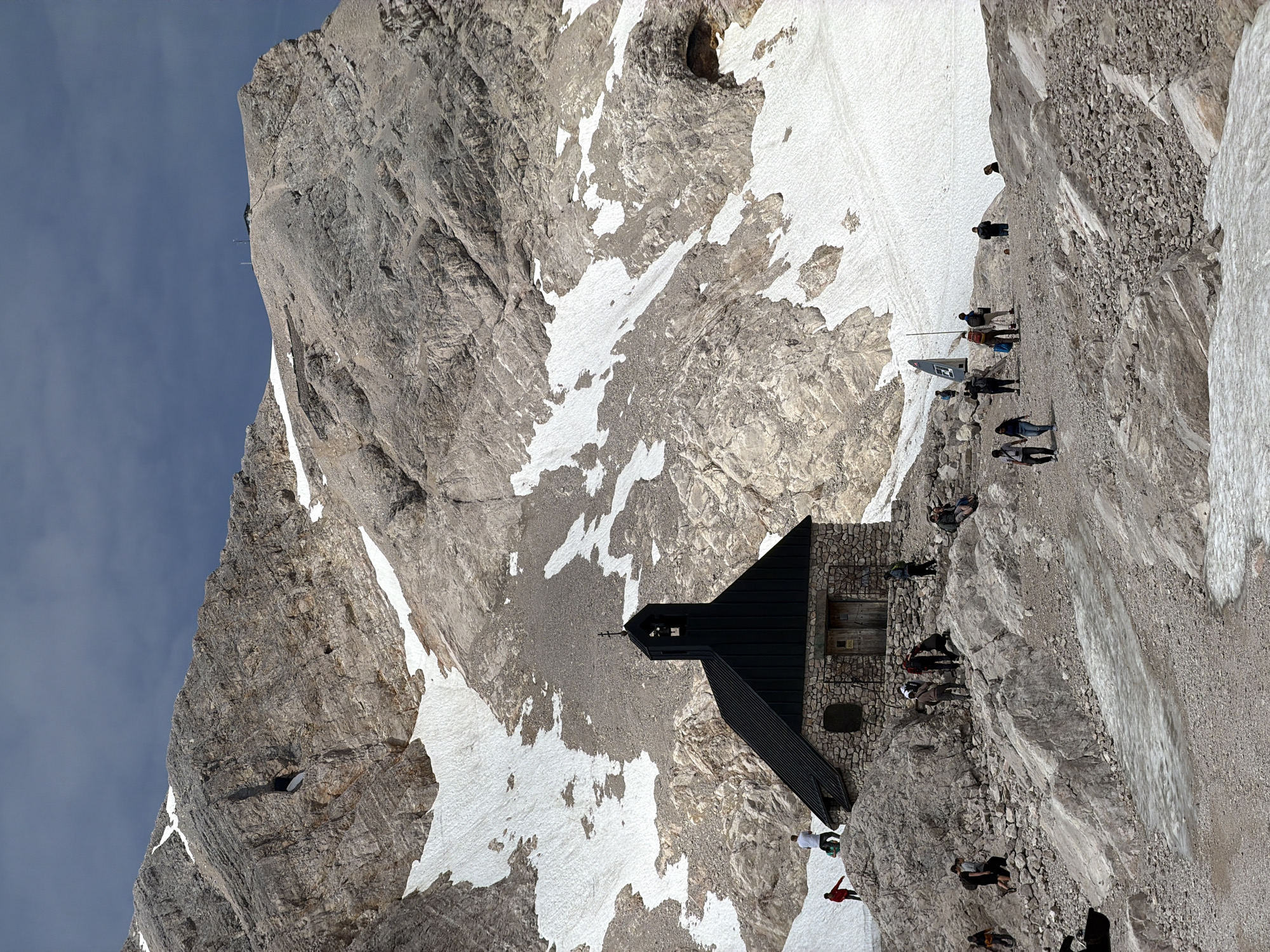Stone alpine chapel on a snowy Bavarian mountainside