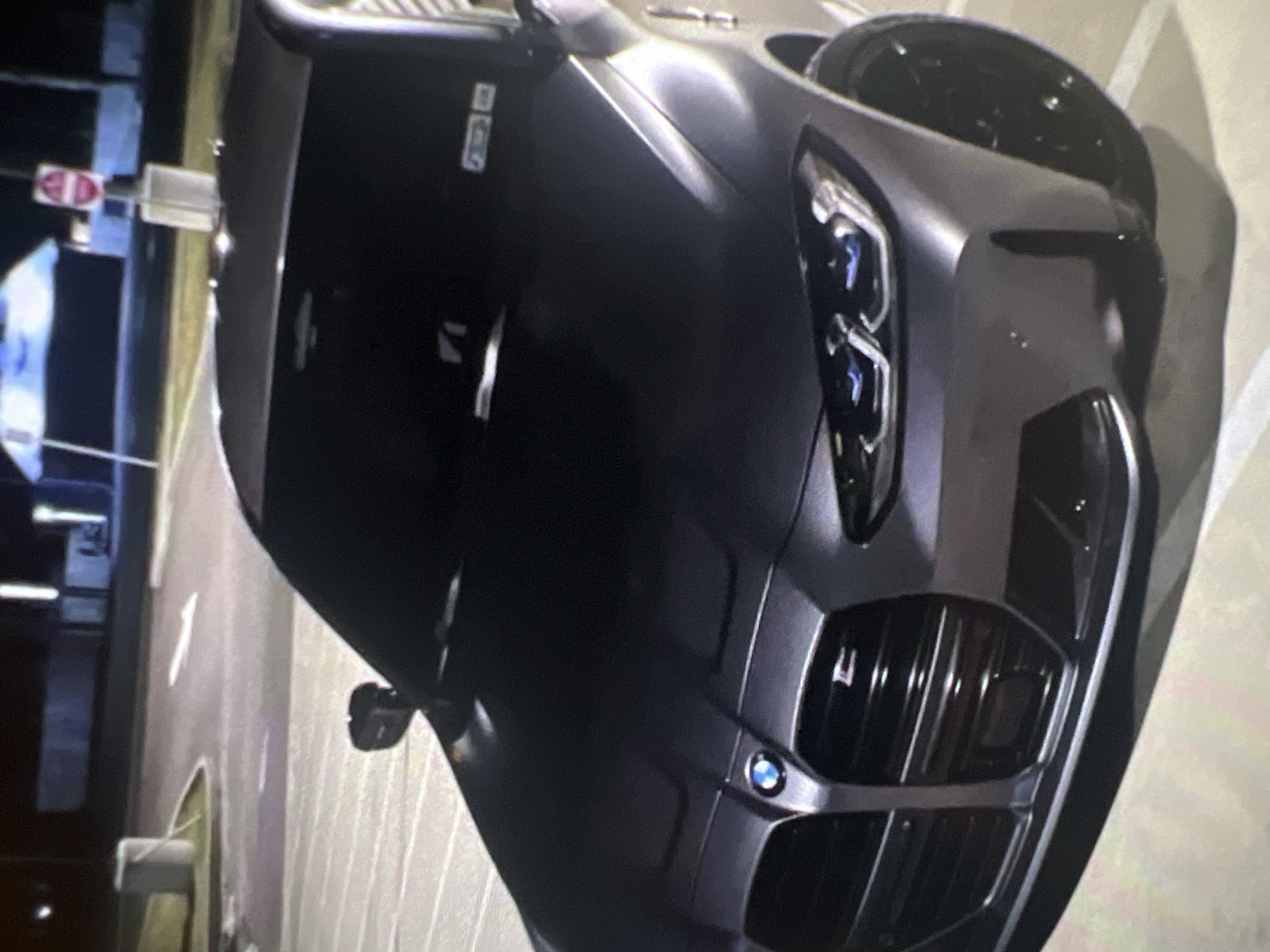 Evening scenes documented in Popovo: parked BMW, restaurant interior