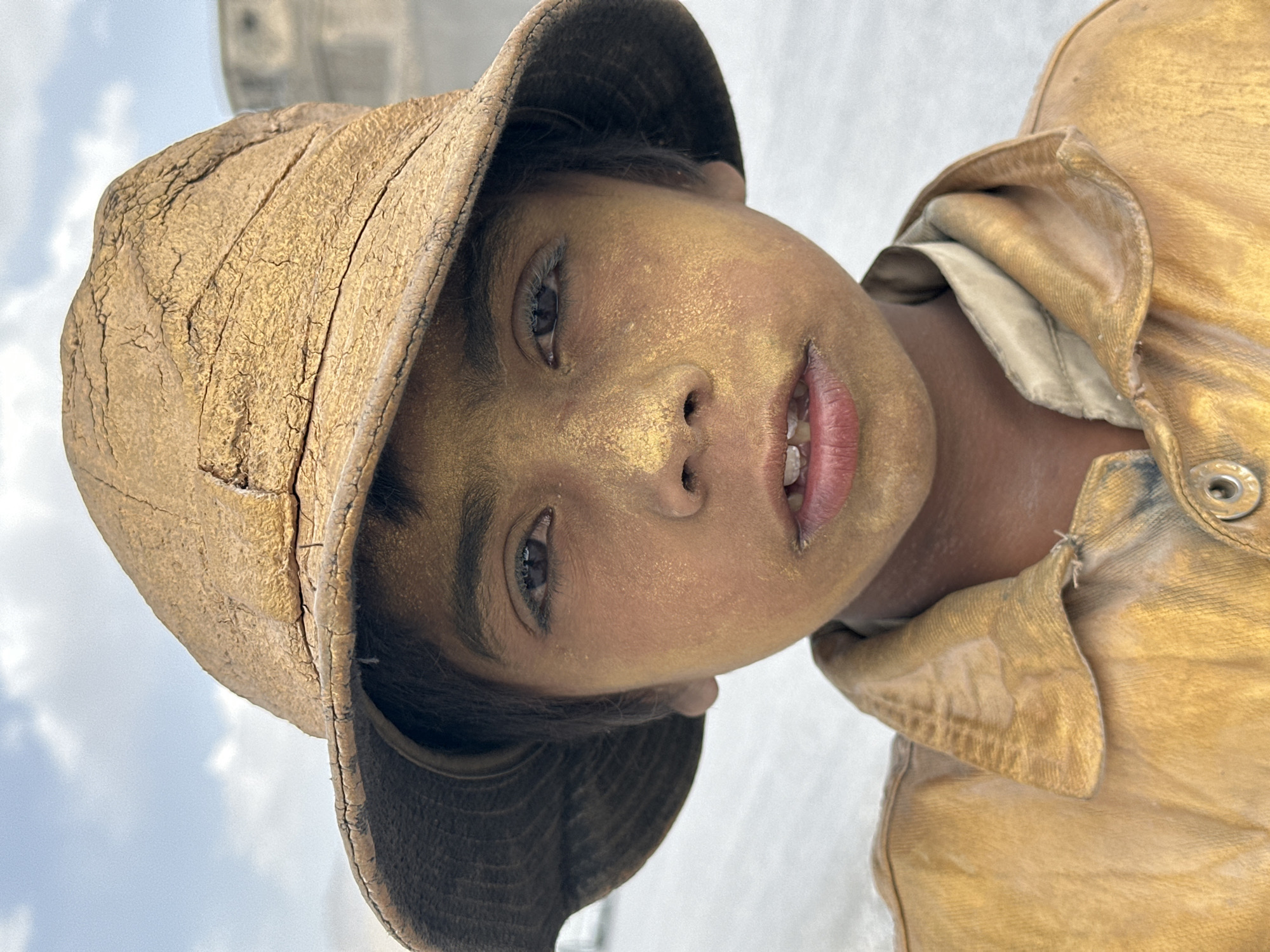 Dust-covered youth photographed on Quetta streets