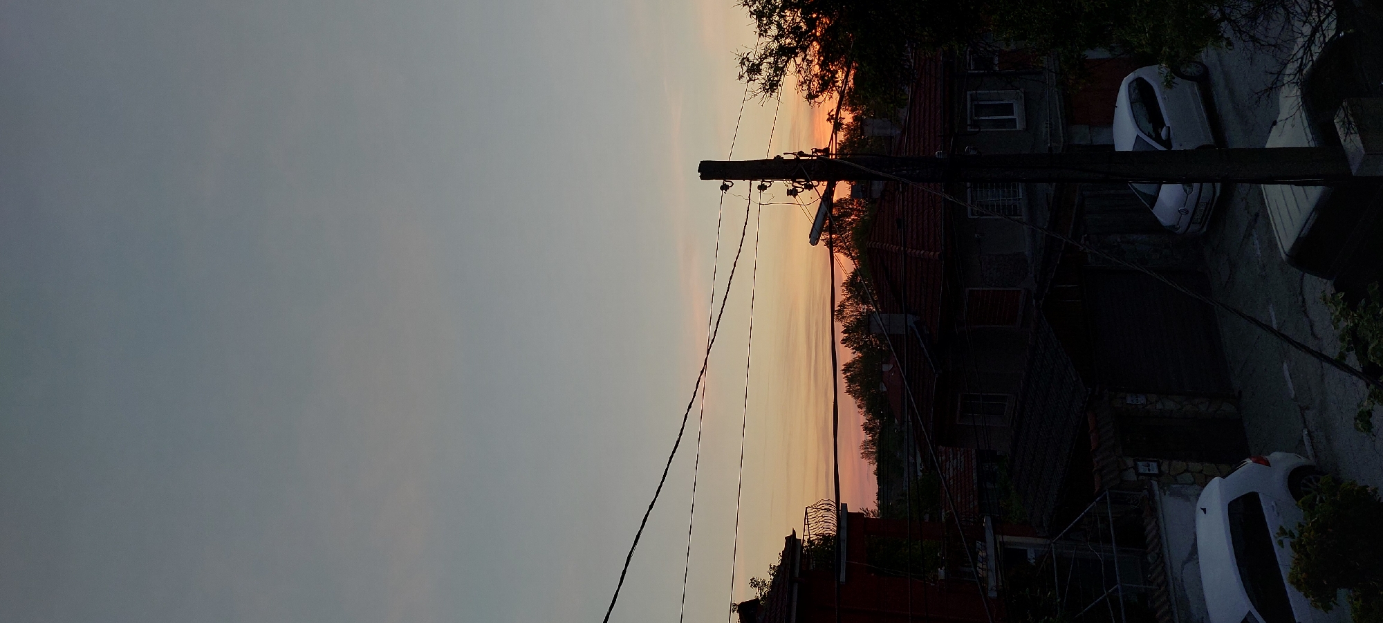 Evening sky colors captured over Yagodovo village rooftops